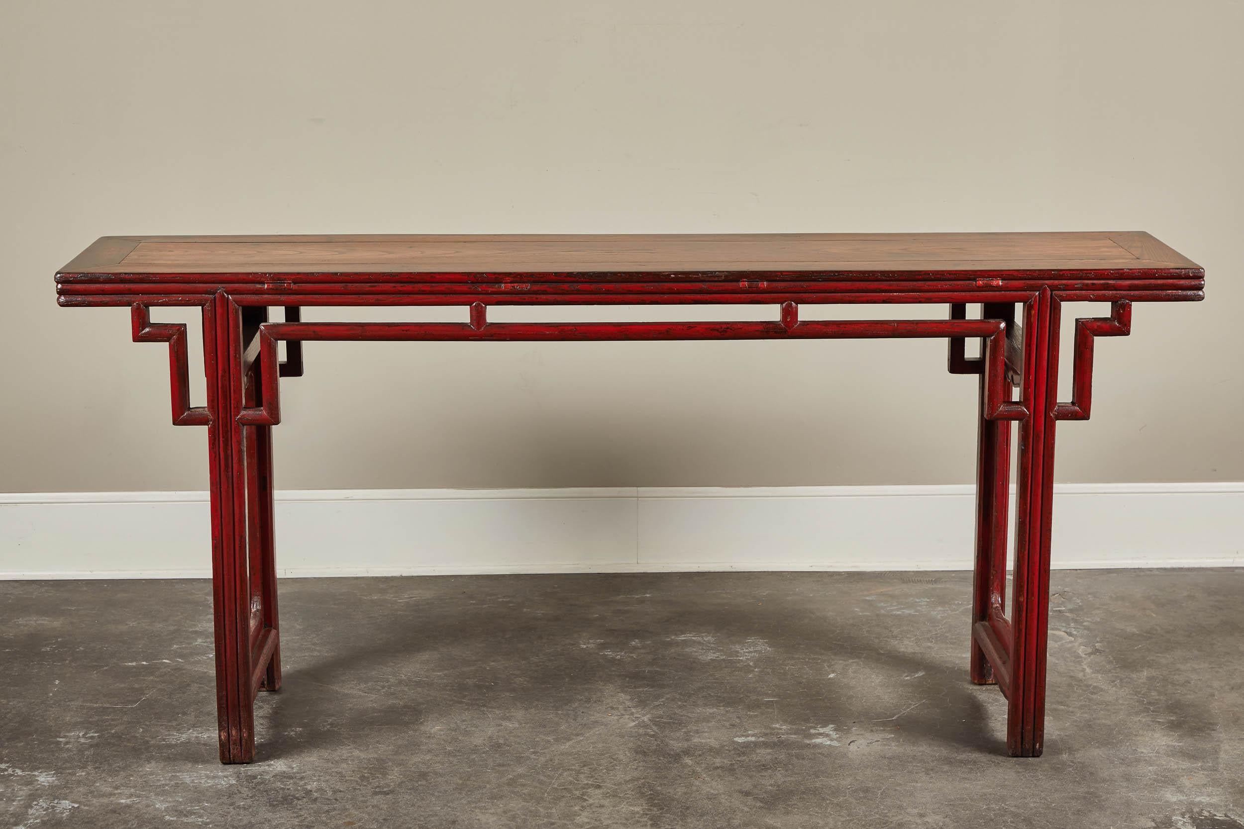 An 18th century Chinese altar table in elm with key pattern from Shanshi. Red lacquer finish with double-faced top.