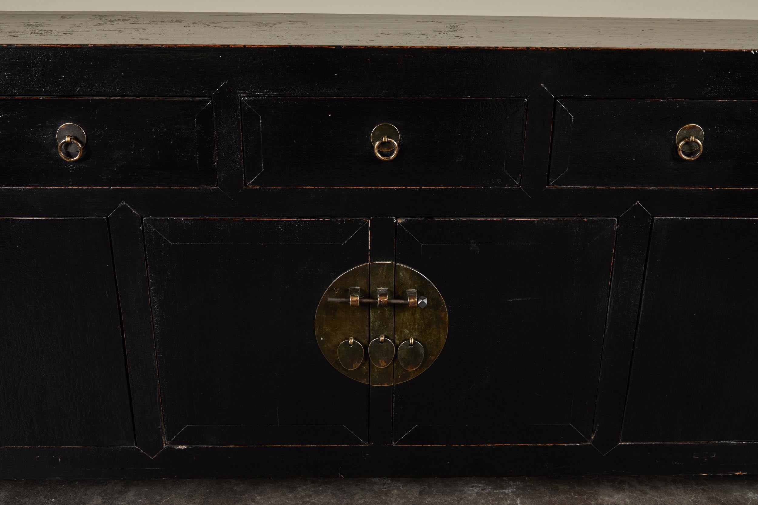 An 18th century five-drawer, six-door black lacquer cabinet from Hebei. Made from elm wood. Remarkable scale makes this piece very versatile while providing ample storage.
