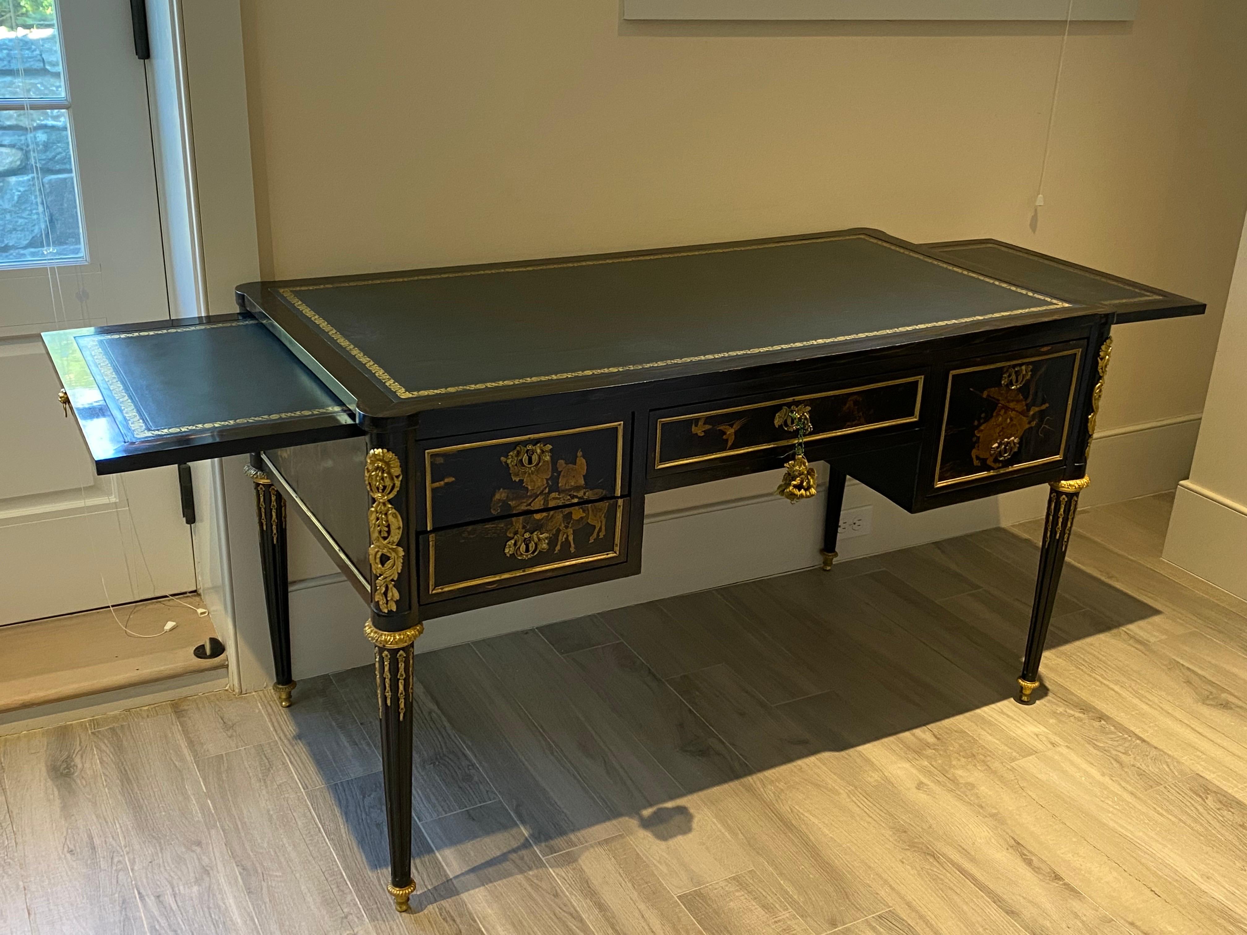 18th C. Continental Black Lacquer Chinoiserie Bureau Plat with Gilt Bronze Ormolu sourced by designers Parish Hadley.
Black lacquer with fine gilt bronze ormolu. Chinoiserie decoration detail is very fine. Two sliding shelves pull out on either side