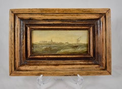 Peinture à l'huile sur panneau hollandaise du 18ème siècle représentant un paysage marin dans un cadre personnalisé en bois de noyer
