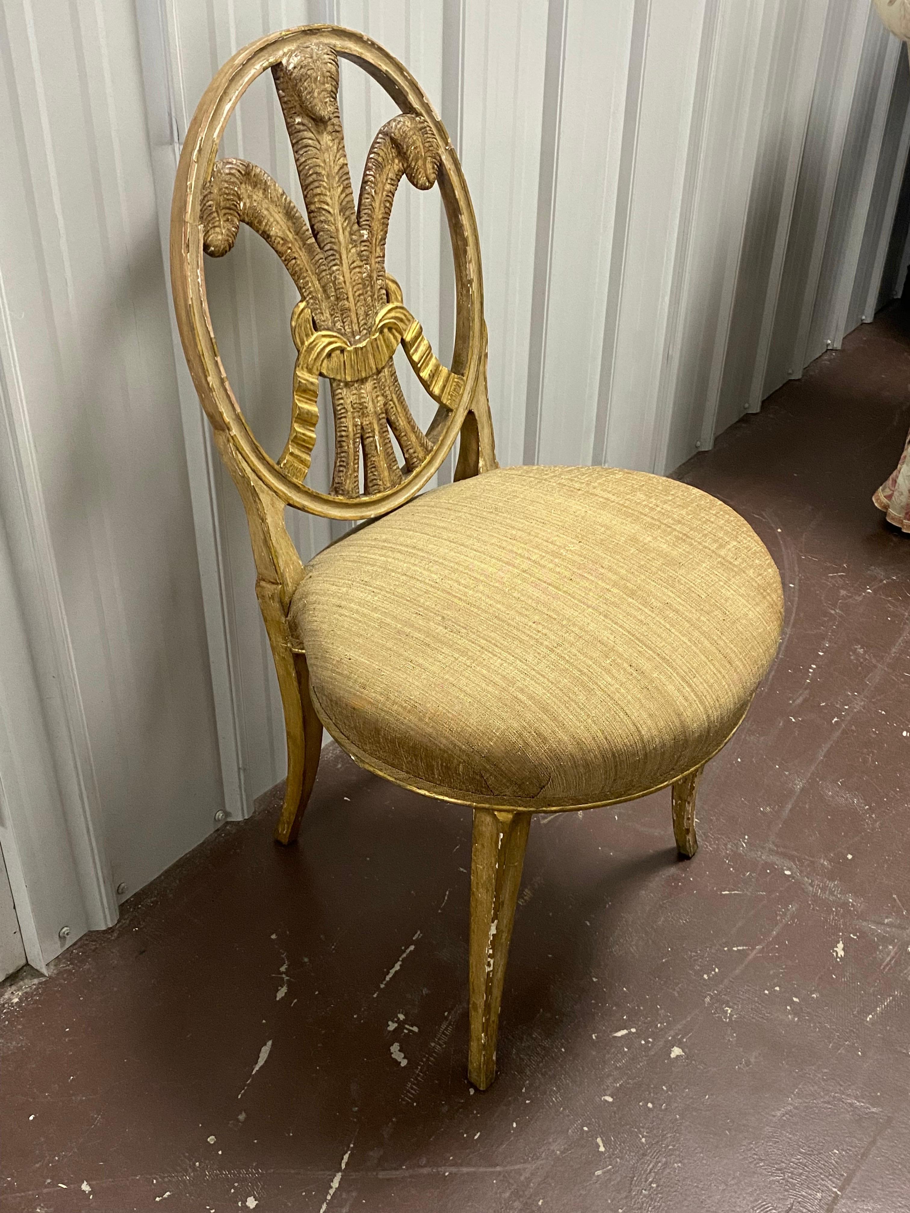 Late 18th c. English Hepplewhite Prince of Wales Parcel-Gilt Side Chair. 
A charming Hepplewhite English Chair in Paint and Parcel-gilt. Prince of Wales plumes seat back with gilded ribbon detail. A rare oval shaped seat covered in a striae plaid