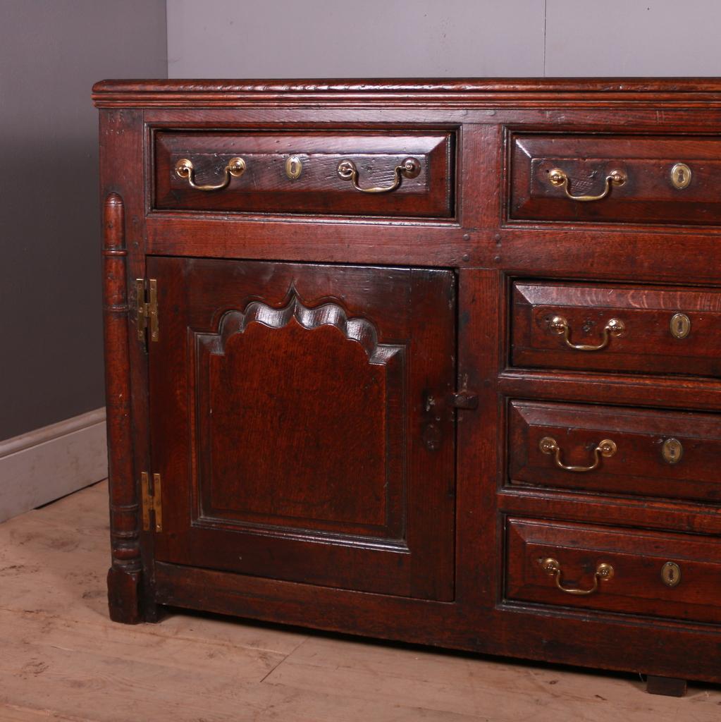 Wonderful 18th C English oak dresser base. Grand scale and a very good colour. 1745.

Dimensions
75 inches (191 cms) Wide
24 inches (61 cms) Deep
36 inches (91 cms) High.

 