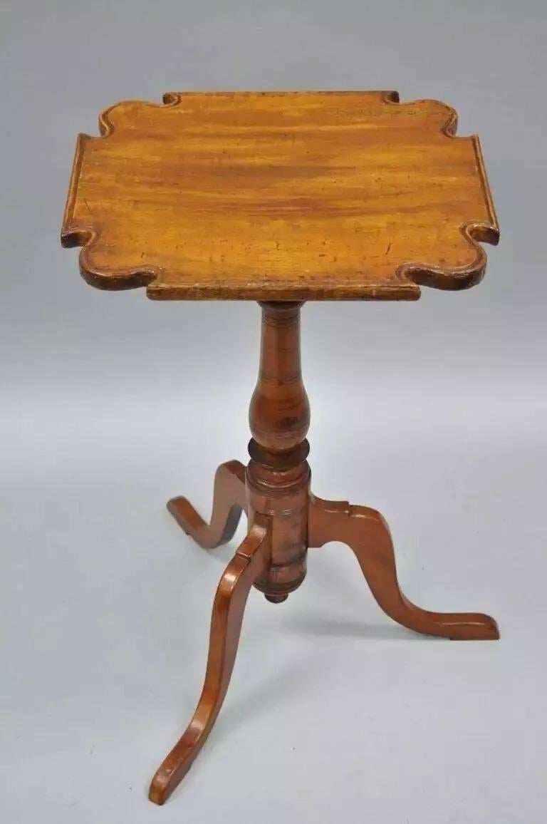 18th Century Cherry Candle Stand Tea Table Tripod Pedestal Scallop Carved Top. Item features remarkable aged patina and desirable finish, tripod base, Queen Anne legs, and carved scallop edge top. Believed to be Circa 18th Century. Measurements: