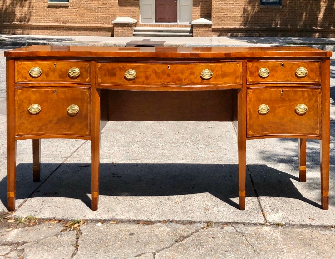 Majestic solid cherry Southern sideboard with unusual faux drawers on each side. This monumental sideboard has a one board solid cherry top and all of the secondary woods are solid cherry. The original eighteen brass oval pulls have a grape cluster