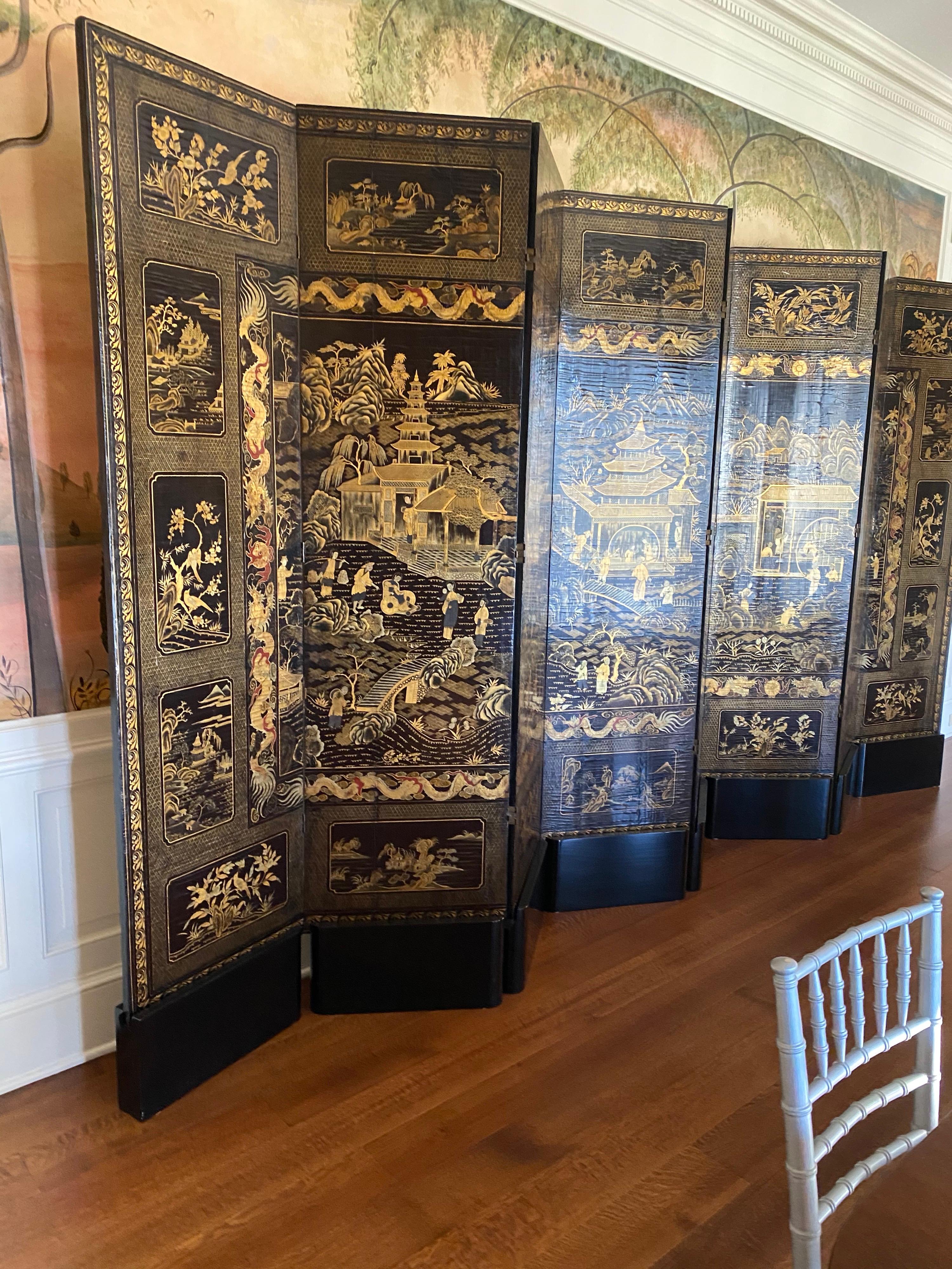 Fine Chinese export black and gilt lacquered eight-panel folding screen
Qing Dynasty
18th century
The reverse with bird and blossom motif, the front with figural architectural landscape scenes.
Measures: 82