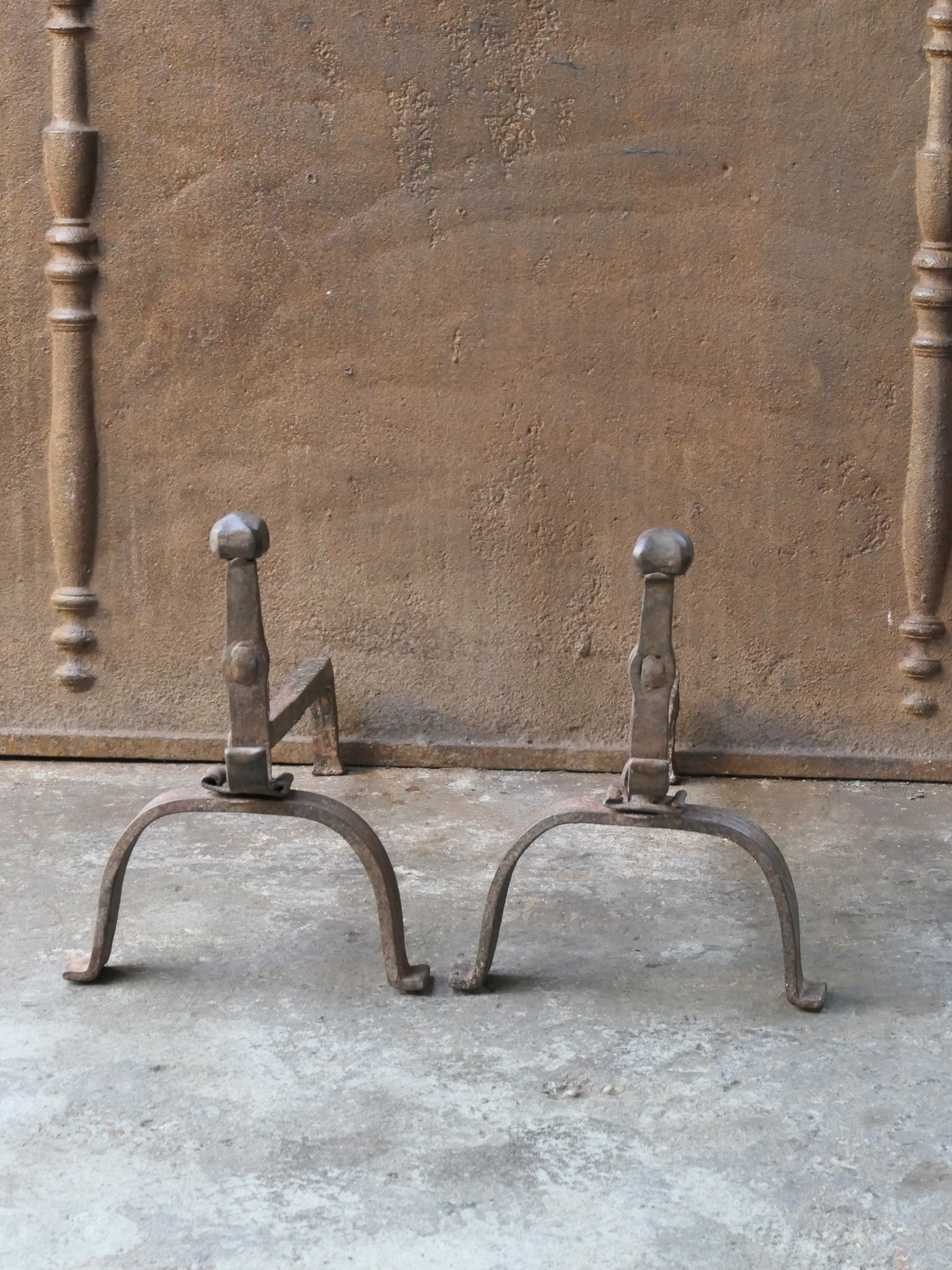 18th century French Louis XV period andirons. Made of wrought iron. The andirons are in a good condition and are fully functional. 