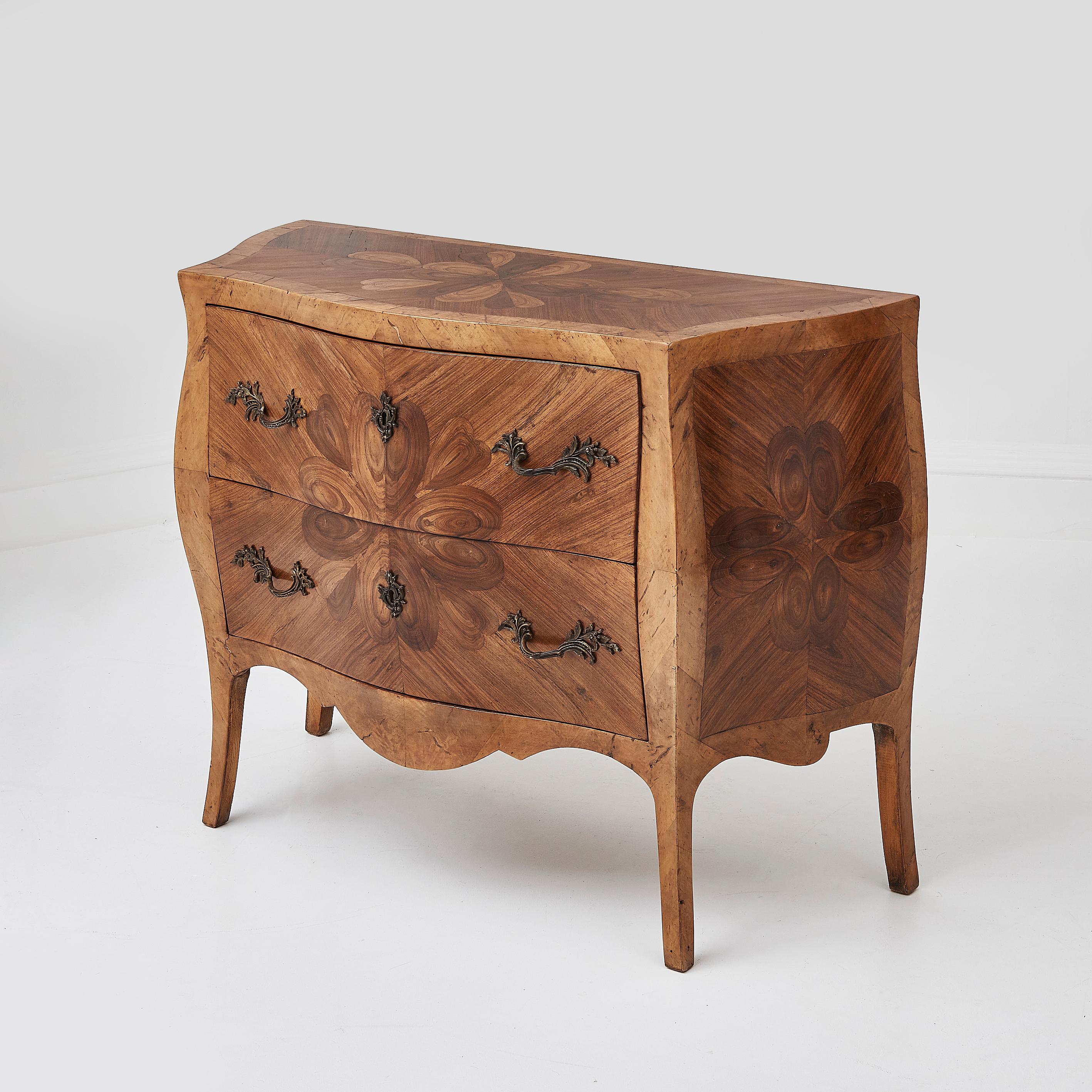 A rare and exquisite example of 18th-century French craftsmanship, this oyster wood chest of drawers showcases the elegance and intricacy characteristic of the period. 

The standout feature of this chest is its stunning oyster veneer, a technique