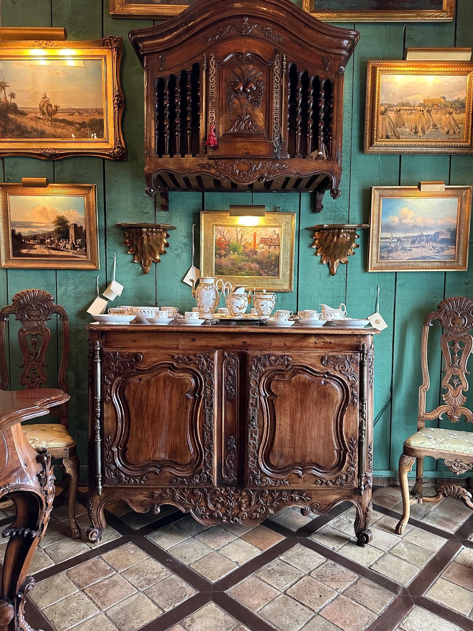 18th C. French Provencal Arlesienne Credenza in Walnut Antiques Buffet Cabinet. This superb 18th century French Louis XV Credence buffet from Arles France is one of the most exceptional buffets. With a stamp H. H on the side. 

The balance of lines