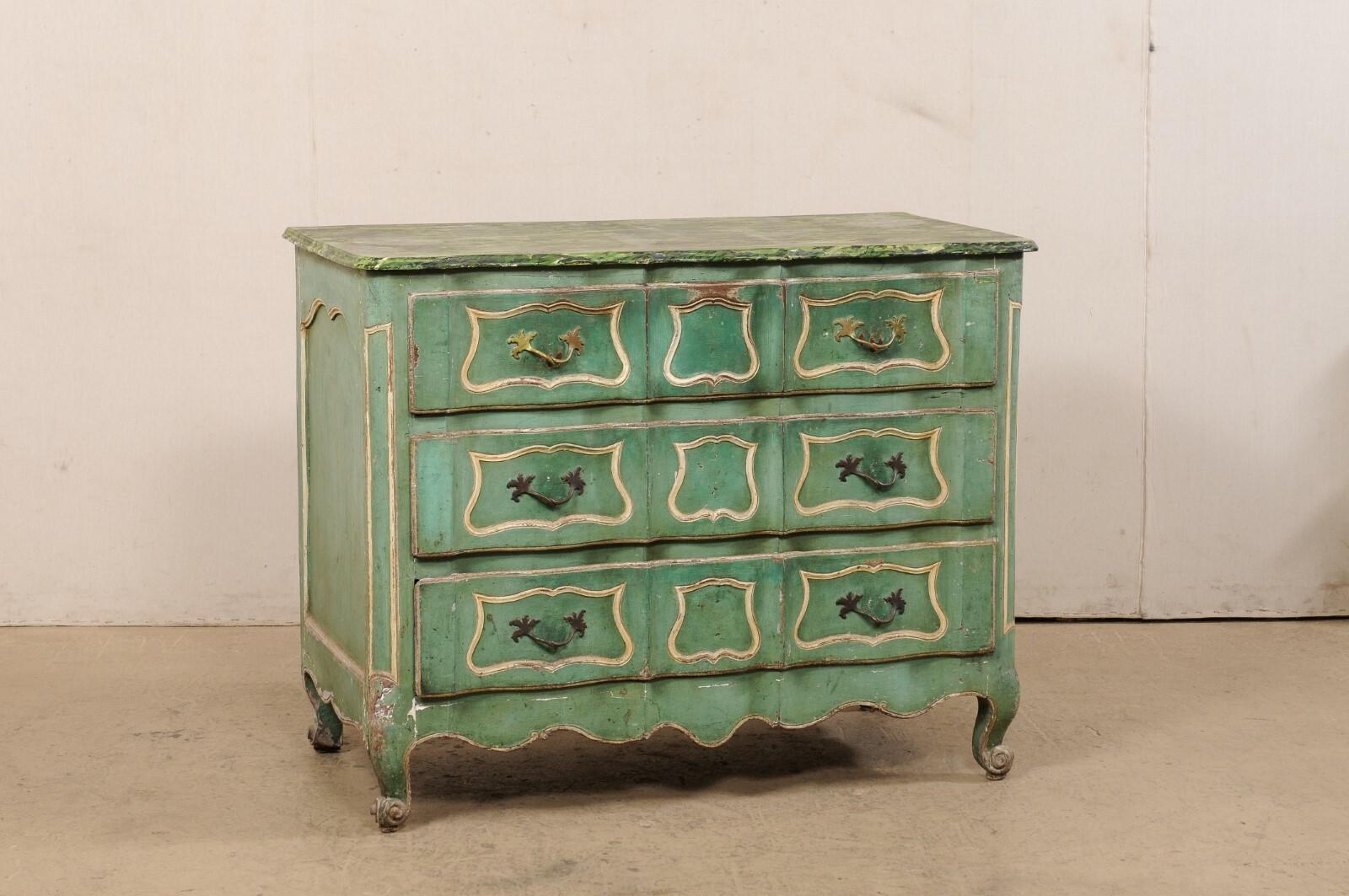 A French Rococo period painted commode from the 18th century. This antique chest from France has a faux-marbled and serpentine-fronted top, with case below continuing the design downward, and housing three dove-tailed, full-sized drawers. Drawer