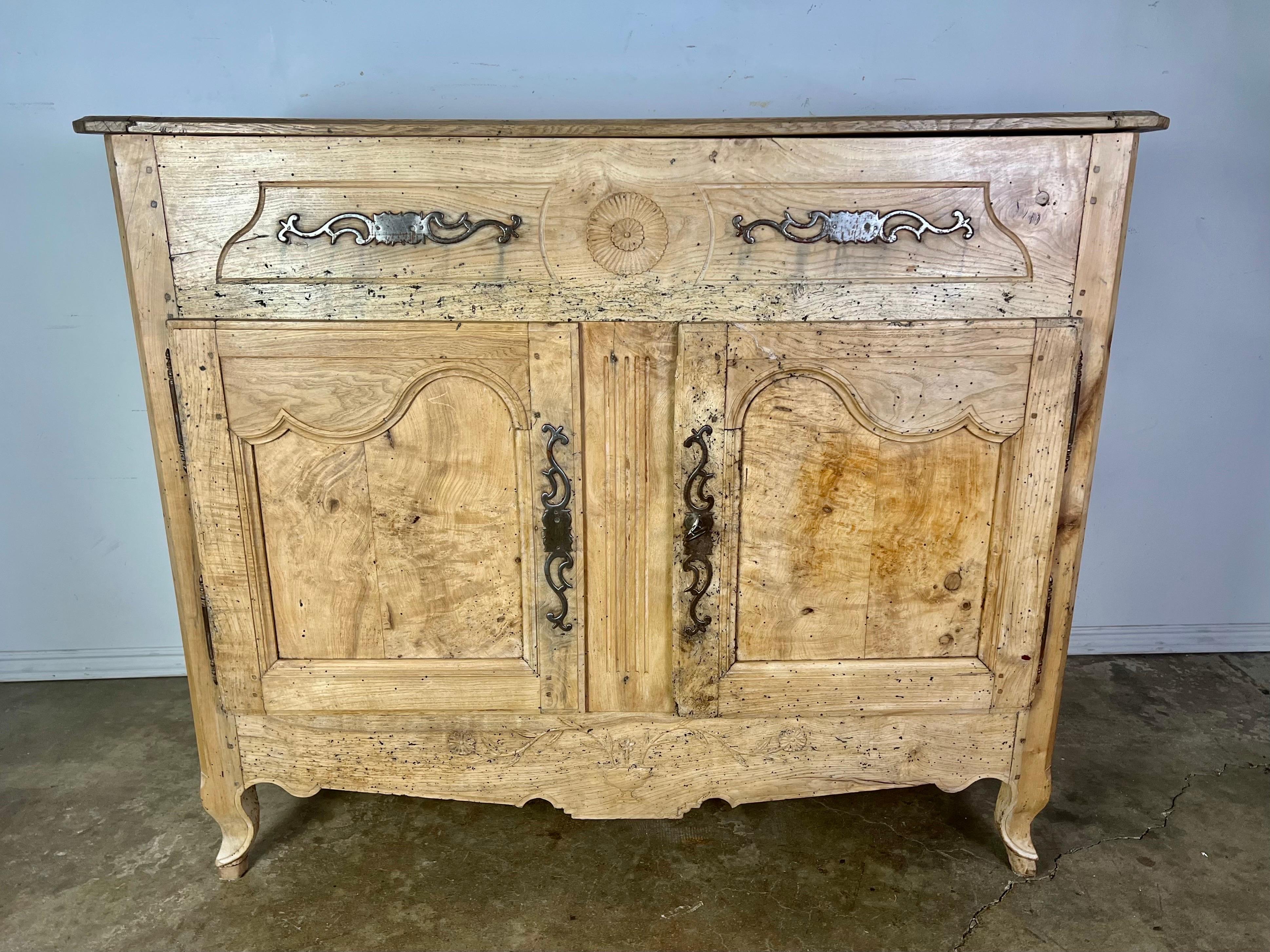 18th century walnut Louis Philippe style French Buffet that has been brought back to a natural finish. It is the first one I have ever seen with a lift top. Great for extra storage. Beautiful patina but wear is consistent with age and use.