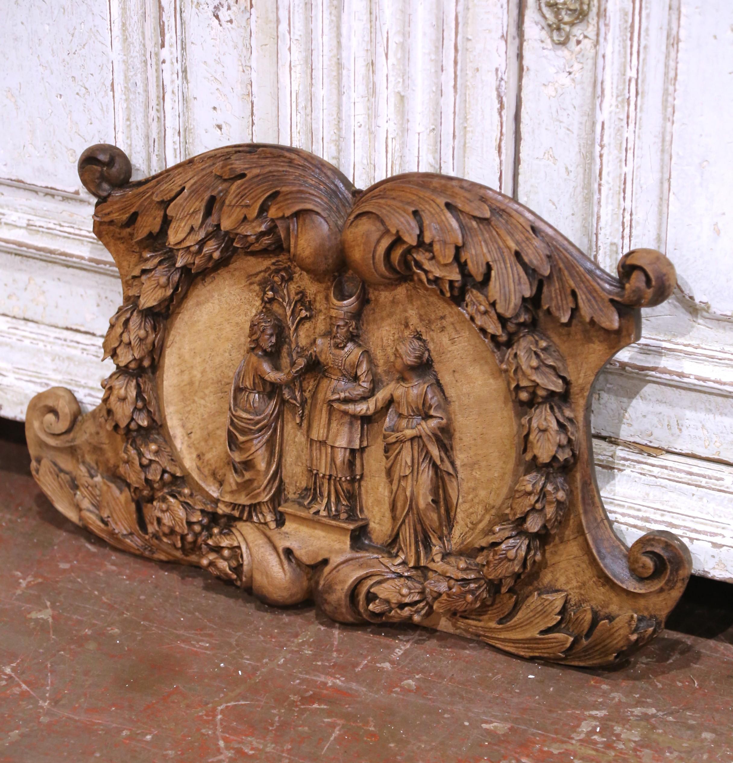 This exceptional hand-carved French walnut relief, circa 1780, likely represents “The Betrothal of the Virgin Mary and Saint Joseph”, a traditional Christian theme depicting the moment when the high priest unites the couple in holy matrimony. The