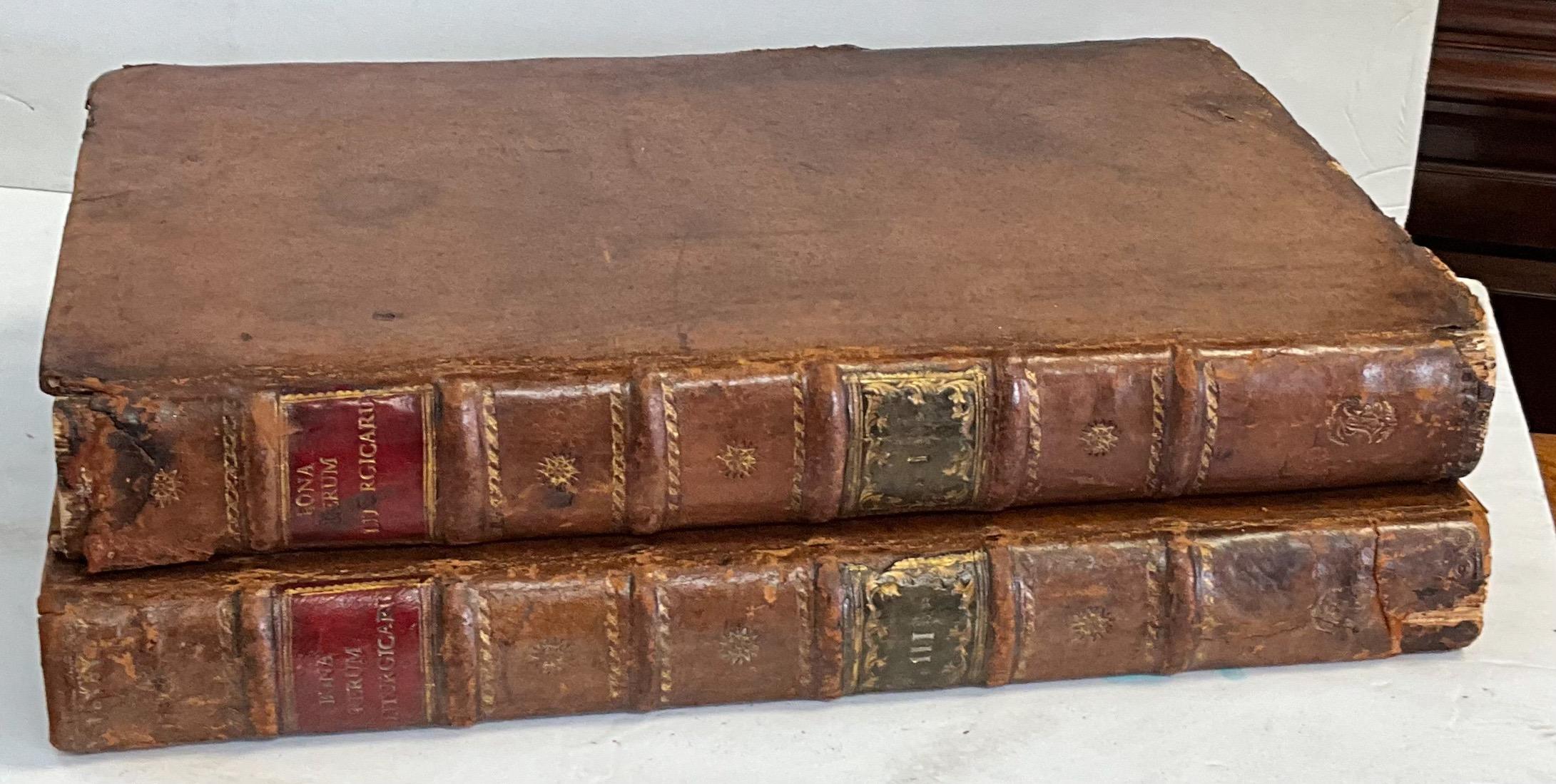 These are a wonderful addition to a library or study! The two books date to 1777 or the era of George III. At first glance, I thought they were Italian, but upon further study, they appear to be in Latin and some sort of religious guidelines. They