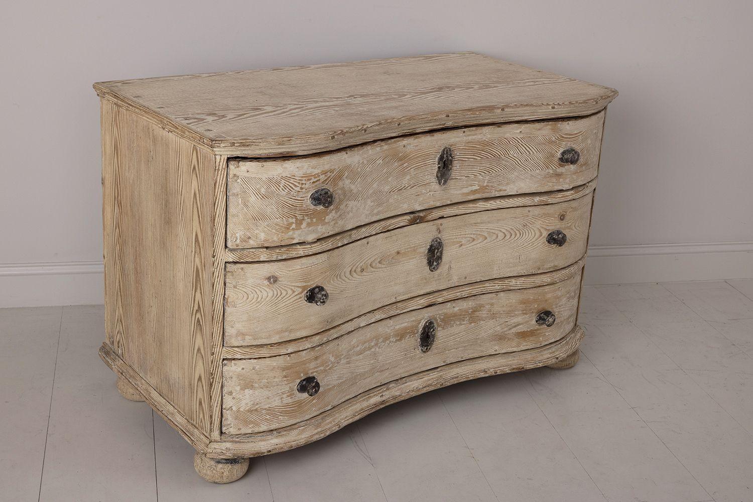An 18th c. German chest of drawers from the Baroque period wearing its original, natural patina. Serpentine front, four bun feet, and original hardware. The shaped drawers are spacious and move easily. Circa 1770. Found in Provence, France.
 