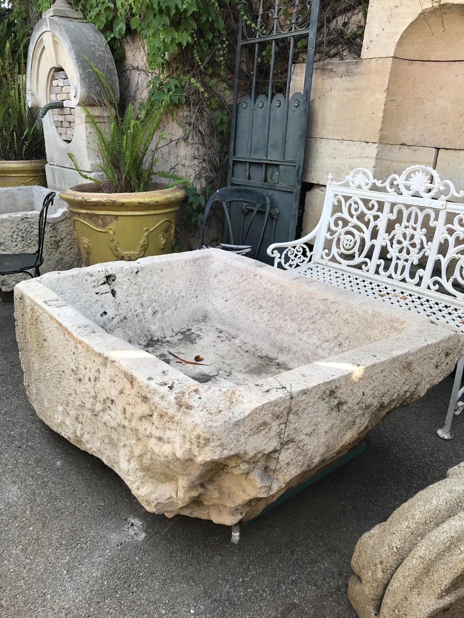 A beautiful uneven 18th century water fountain basin of hand carved stone. It could be installed with a simple bronze spout or a carved stone fountain head, we have many options of them, in order to create a charming garden water fountain. This good