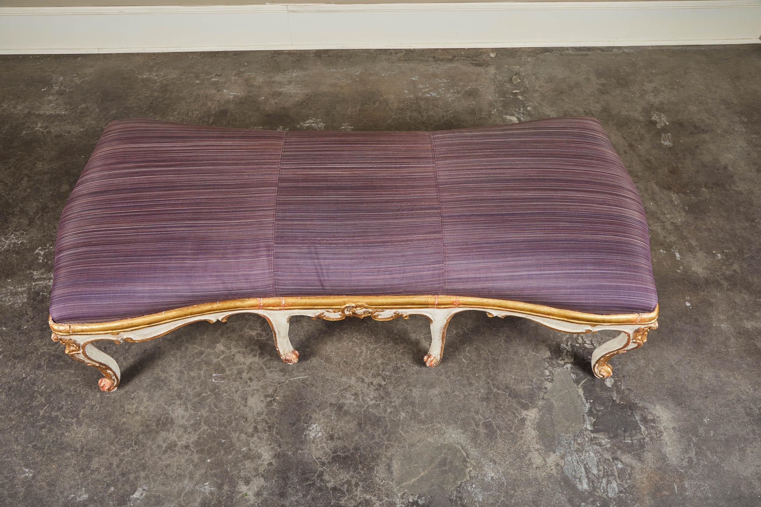 Italian Rococo style bench composed of two 18th century armchairs as base. 23.25” at narrowest bench cushion. Purple horsehair upholstery across entire cushion.