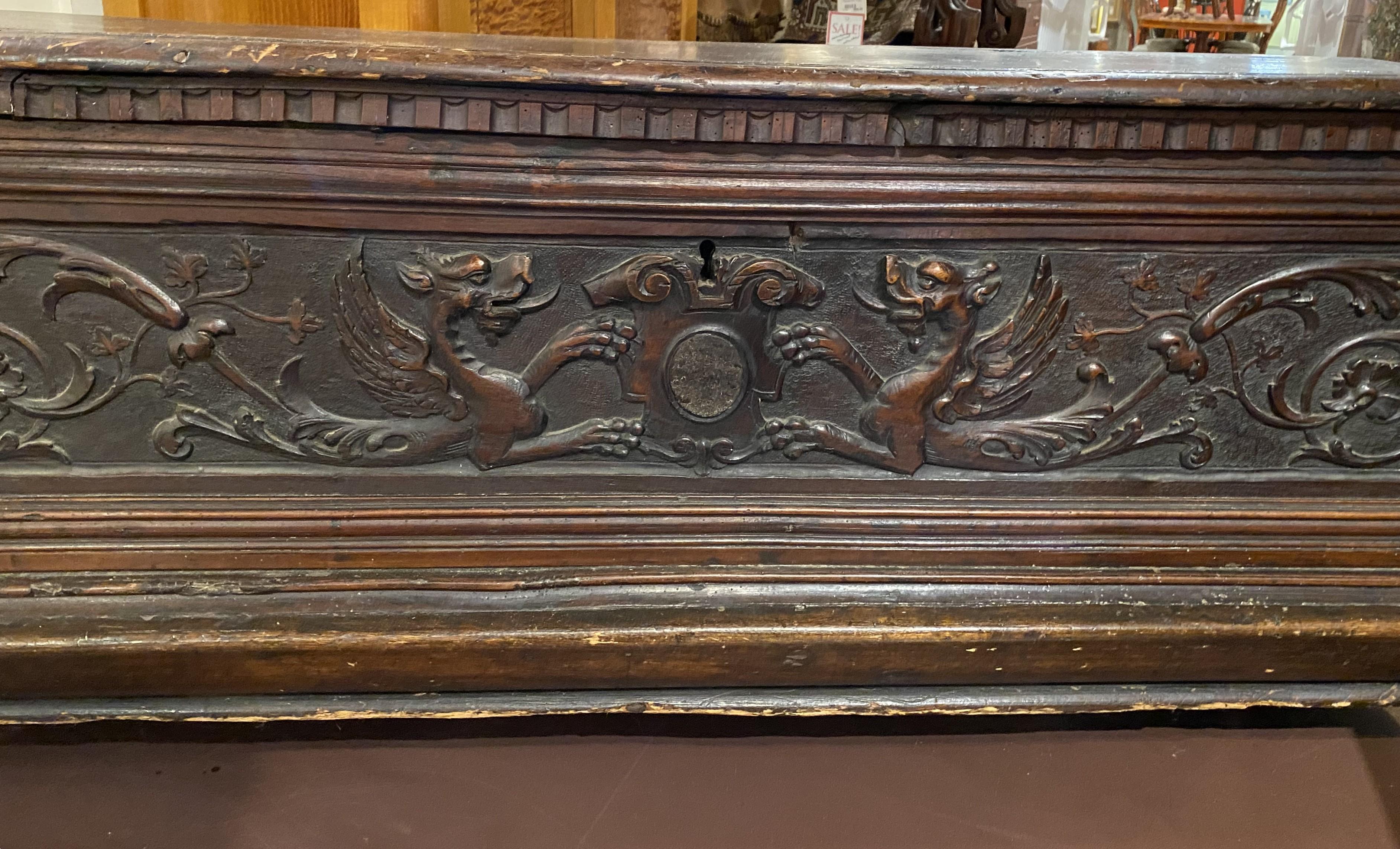 Baroque 18th c Italian Carved Cassone with Dragon Decoration and Paw Feet For Sale