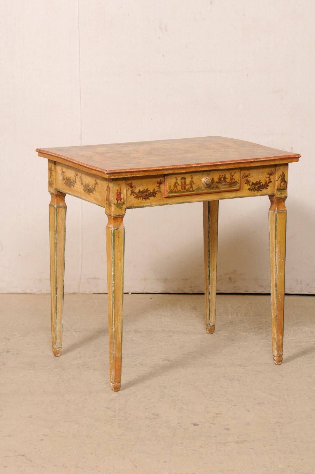 An Italian occasional table with its original laca povera finish from the 18th century. This antique table from Italy retains its original 