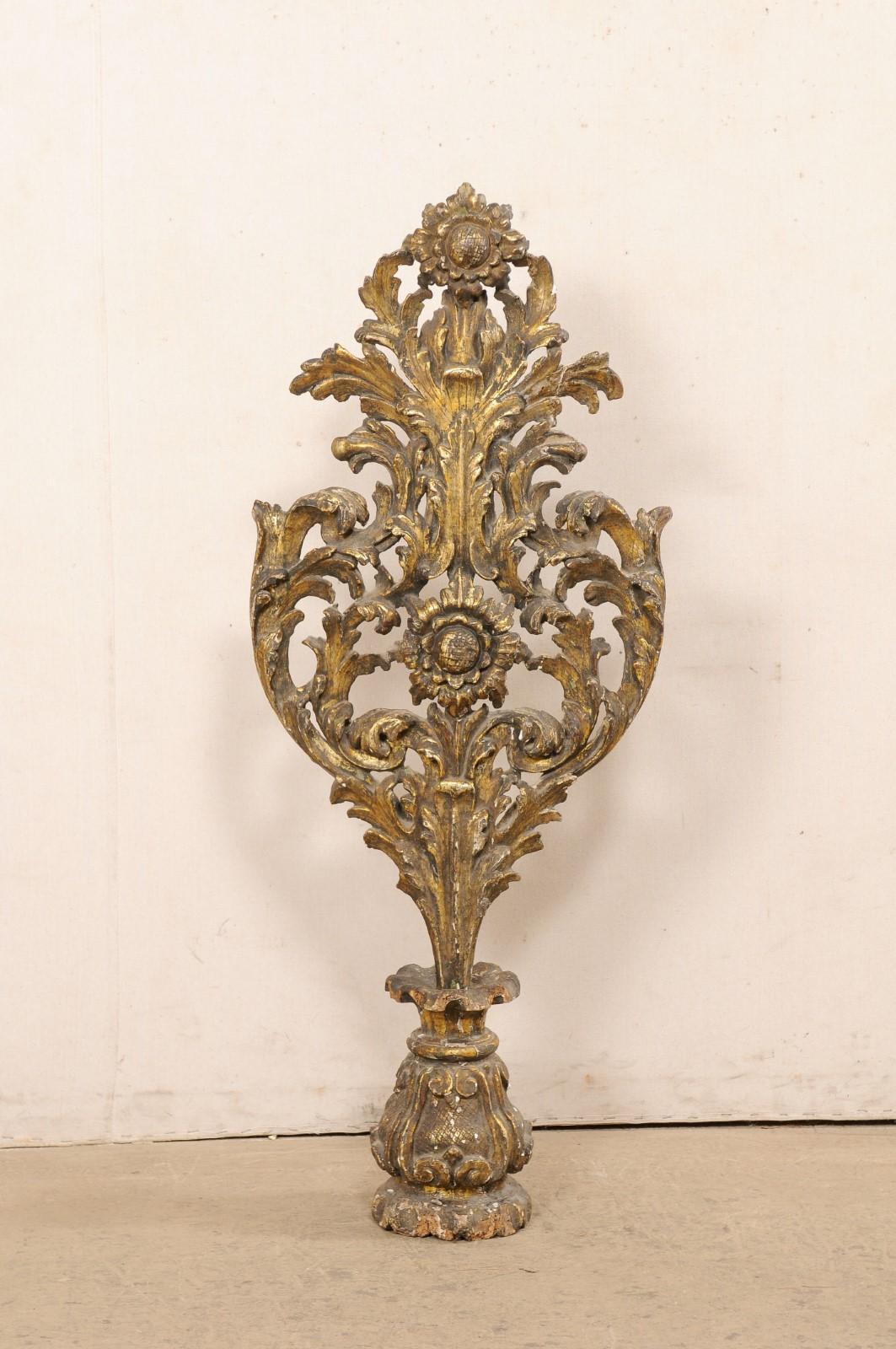 An Italian carved-wood monumental finial, with its original finish, from the 18th century. This antique fragment from Italy has a shapely body, and has been beautifully pierce-carved with flowing acanthus leaves and sunflowers, that are supported by