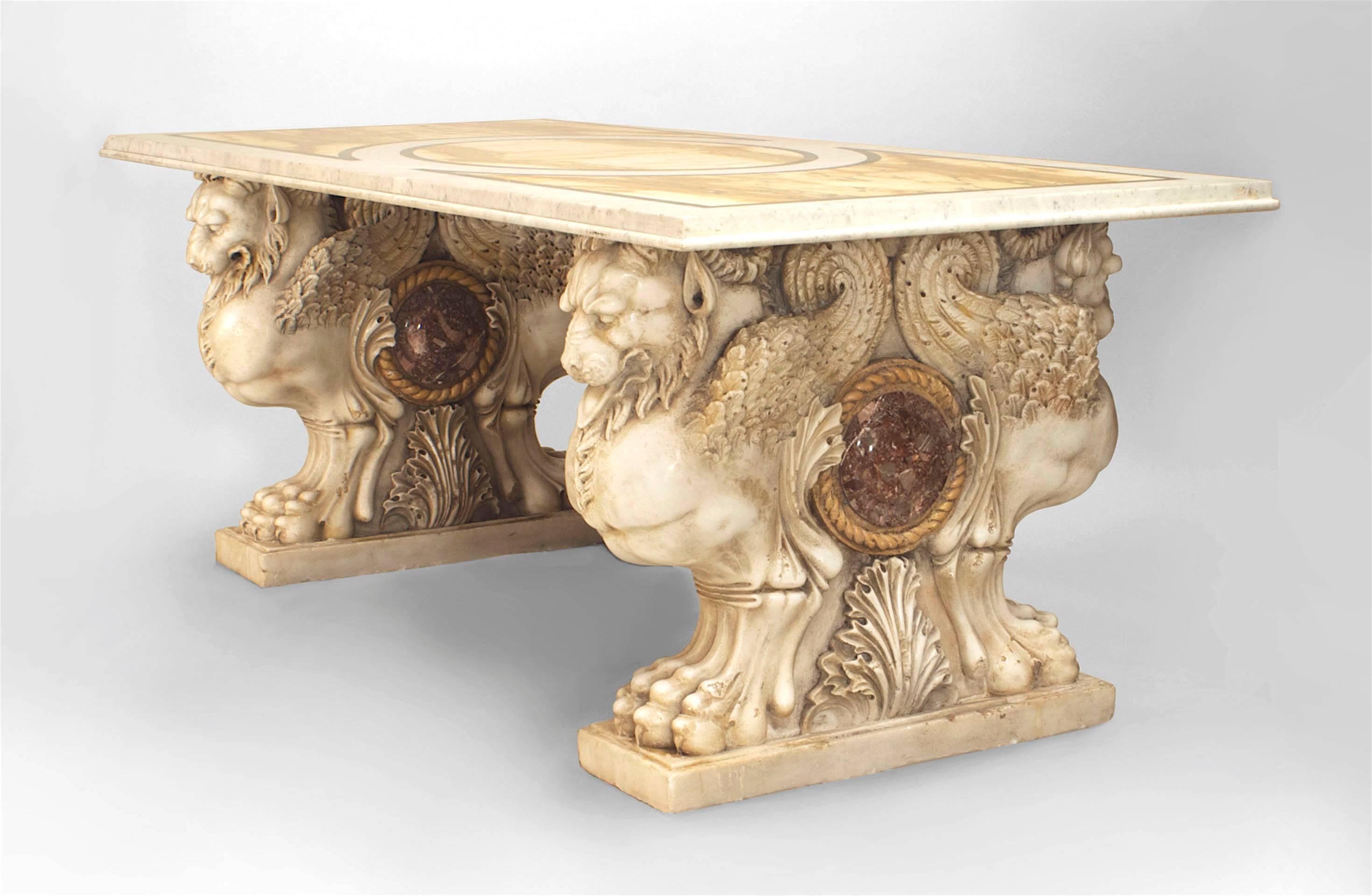 Italian Neo-classic (18th Century) center table with 2 white marble bases having carved winged lions and claw feet centering a rouge & Siena marble rondel supporting a later inlaid rectangular marble top.
