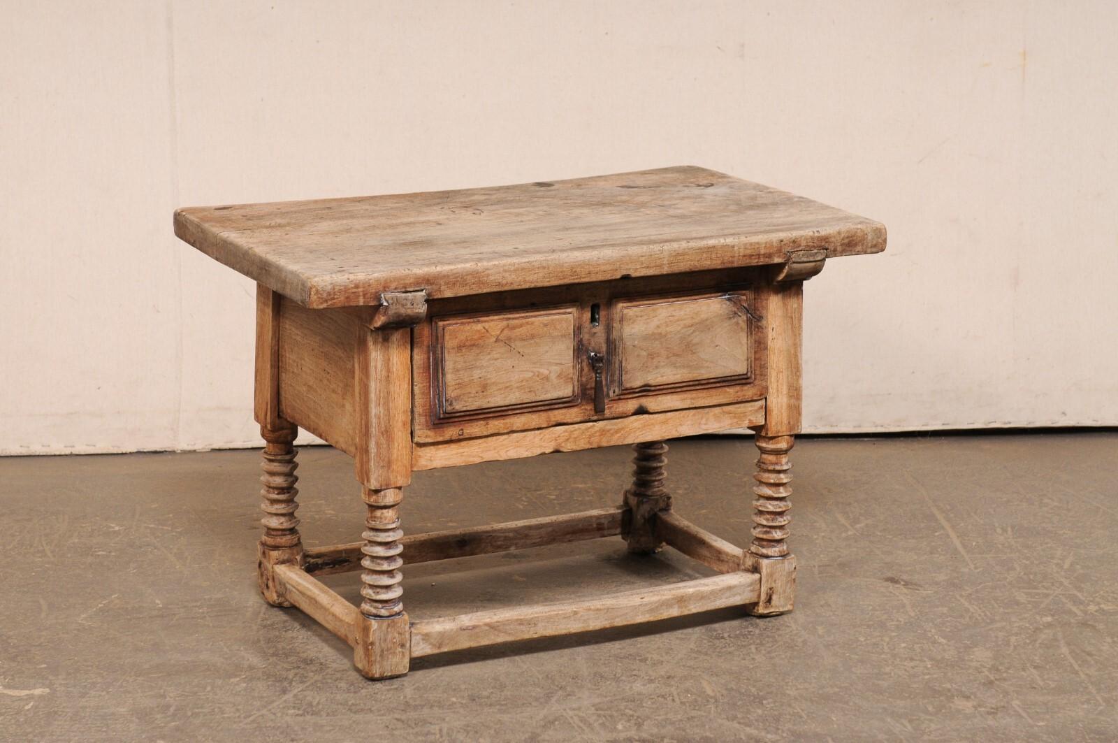 A beautifully rustic Italian carved-wood coffee or occasional table with single drawer, from the 18th century. This antique table from Italy has a thick-cut rectangular-shaped top, which overhangs the deep apron below which houses a single