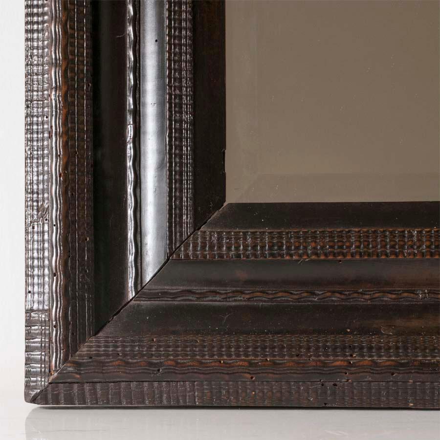 18th century Italian walnut ebonized mirror with finely carved guilloche detail.
Measures: H 21.75, D 19.5, W 2.25 in.
  