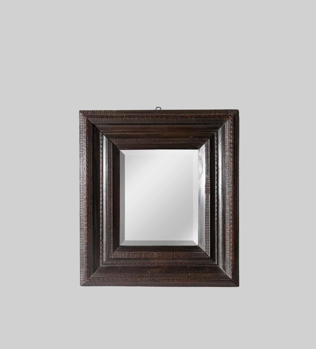 European 18th Century Italian Walnut Ebonized Mirror with Finely Carved Guilloche Detail