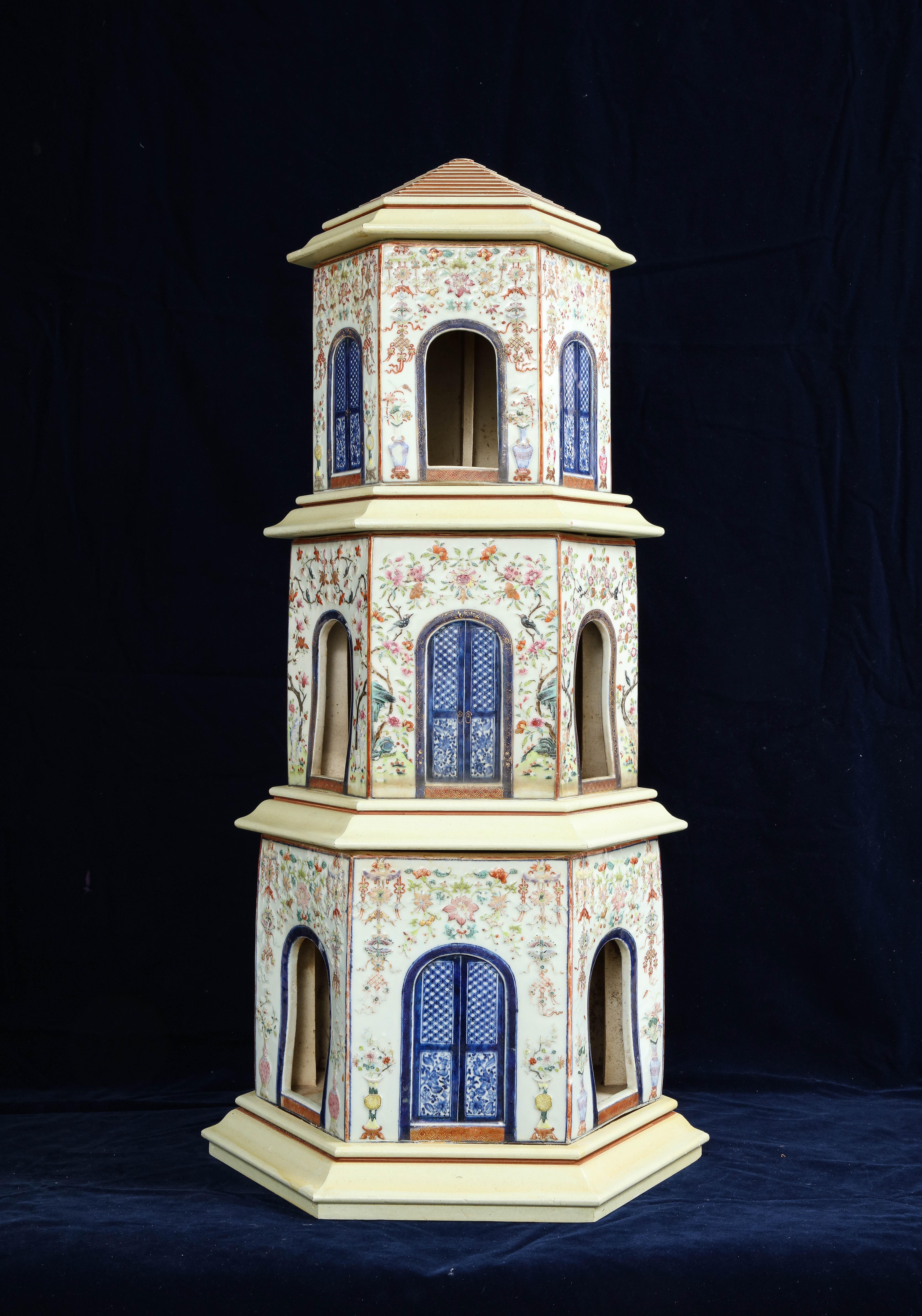 An 18th Century Large Chinese Qianlong Period Famille Rose Porcelain Pagoda Centerpiece.  Dating back to the 18th century, this porcelain masterpiece stands tall at an impressive height of 34 inches, showcasing a captivating fusion of colors and