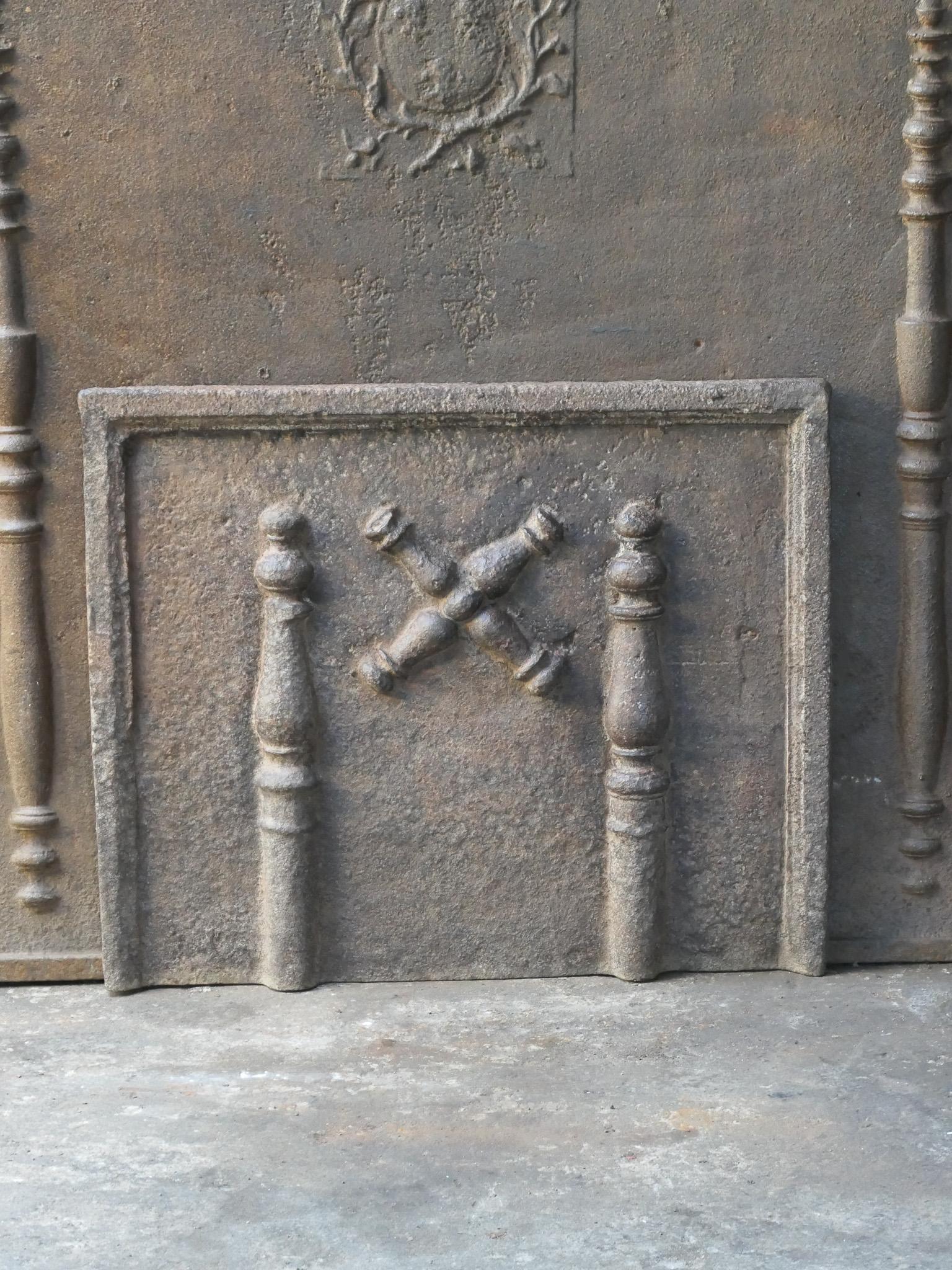 18th century Louis XIV period French fireback with a Saint Andrew's cross and two pillars of Hercules. Saint Andrew is said to have been martyred on a cross in this shape. As a result the cross became a sign for humility and sacrifice. The pillars