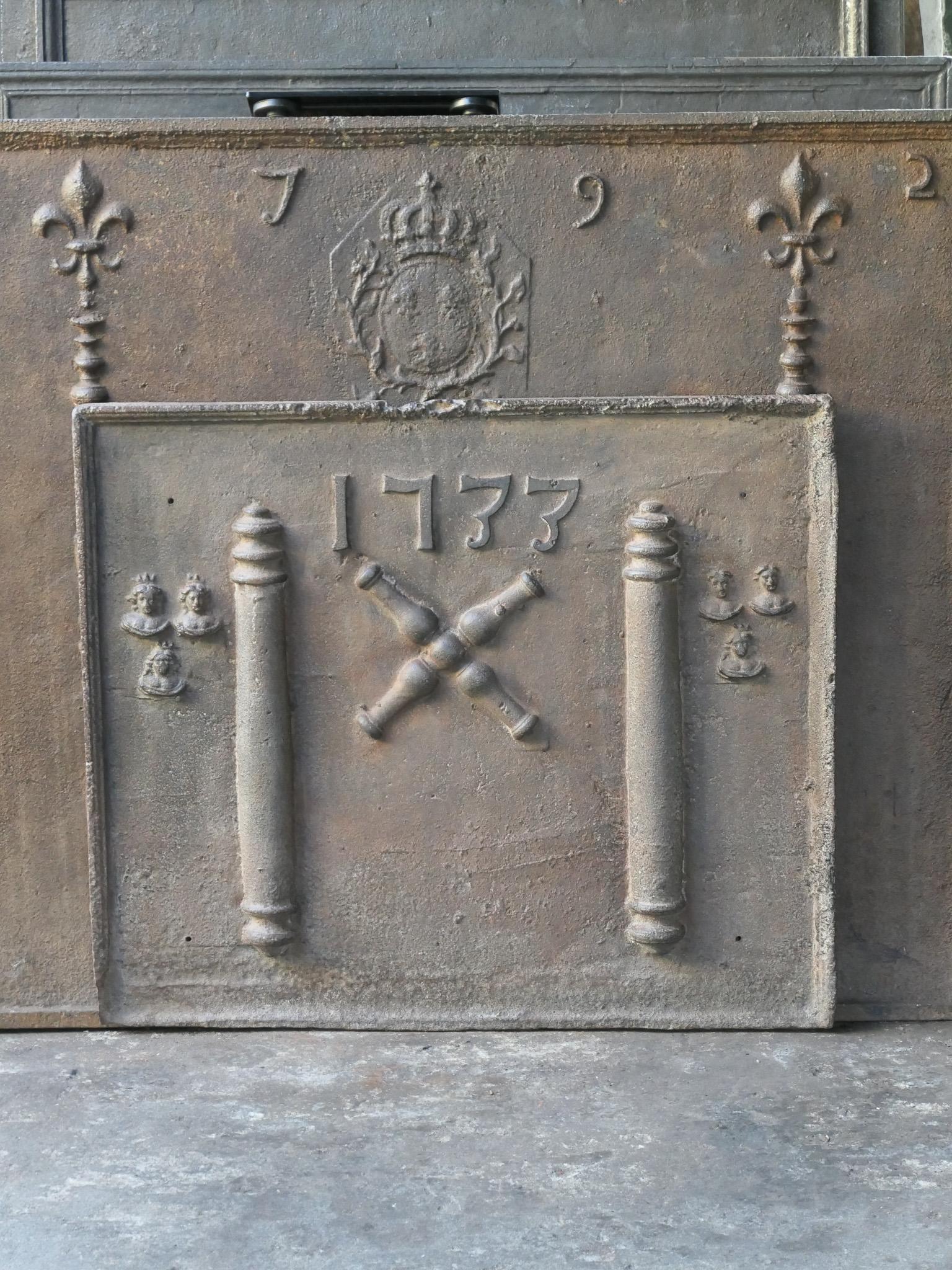 18th century Louis XIV period French fireback with a Saint Andrew's cross and two pillars of Hercules. Saint Andrew is said to have been martyred on a cross in this shape. As a result the cross became a sign for humility and sacrifice. The pillars