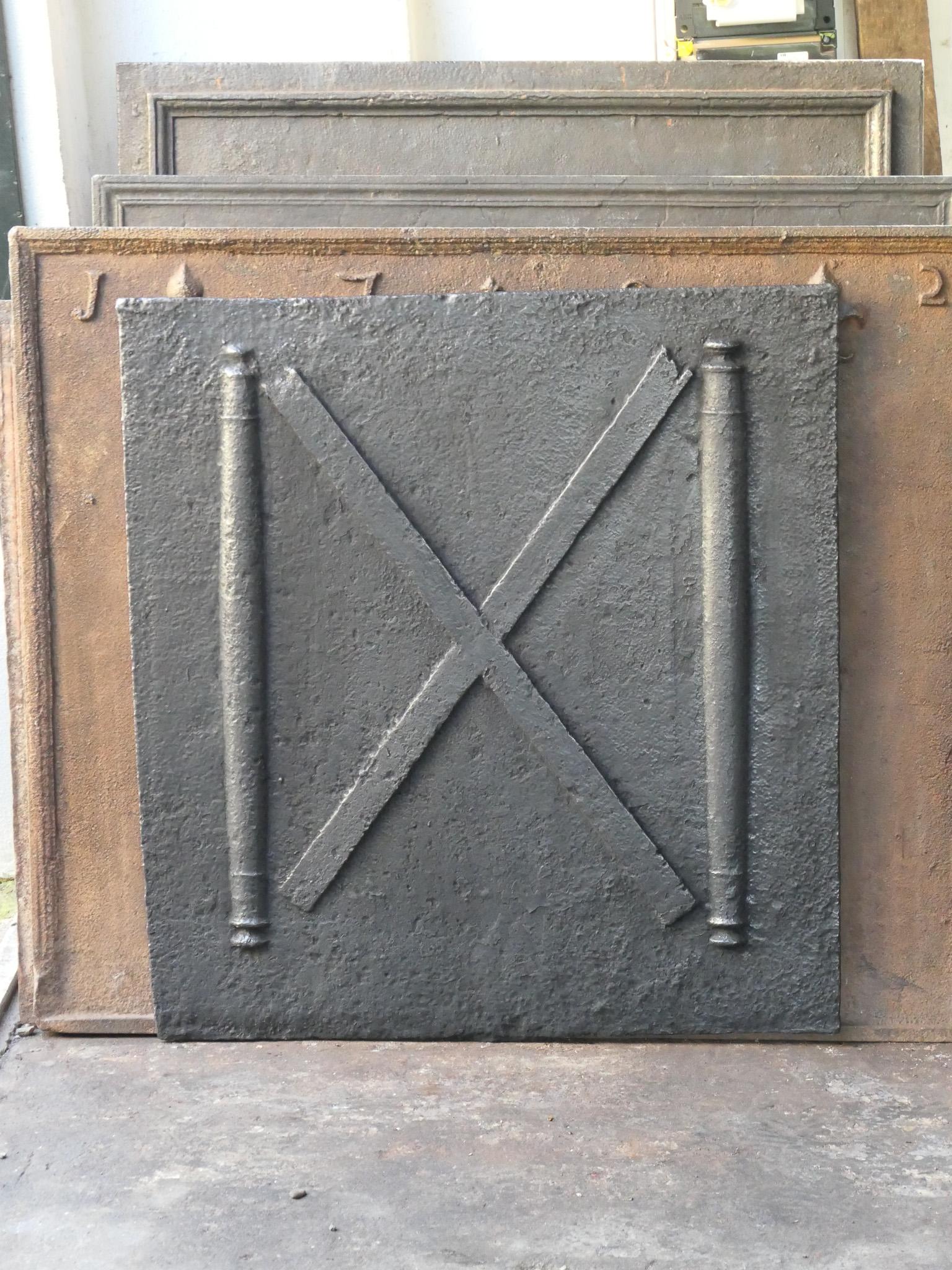 18th century Louis XIV period French fireback with a Saint Andrew's cross and two pillars of Hercules. Saint Andrew is said to have been martyred on a cross in this shape. As a result the cross became a sign for humility and sacrifice. The pillars