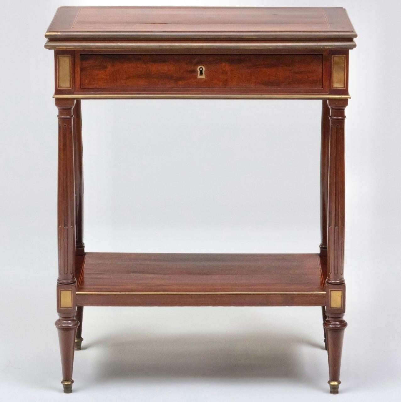 18th C. Louis XVI Mahogany and Marble Writing Table 
With Brass Mounts, Ca. 1790
Wonderful small writing table, with flip top with marble work surface, and drawer  with pull out leather writing surface, Ca 1790.   Perfet as a side tale or small