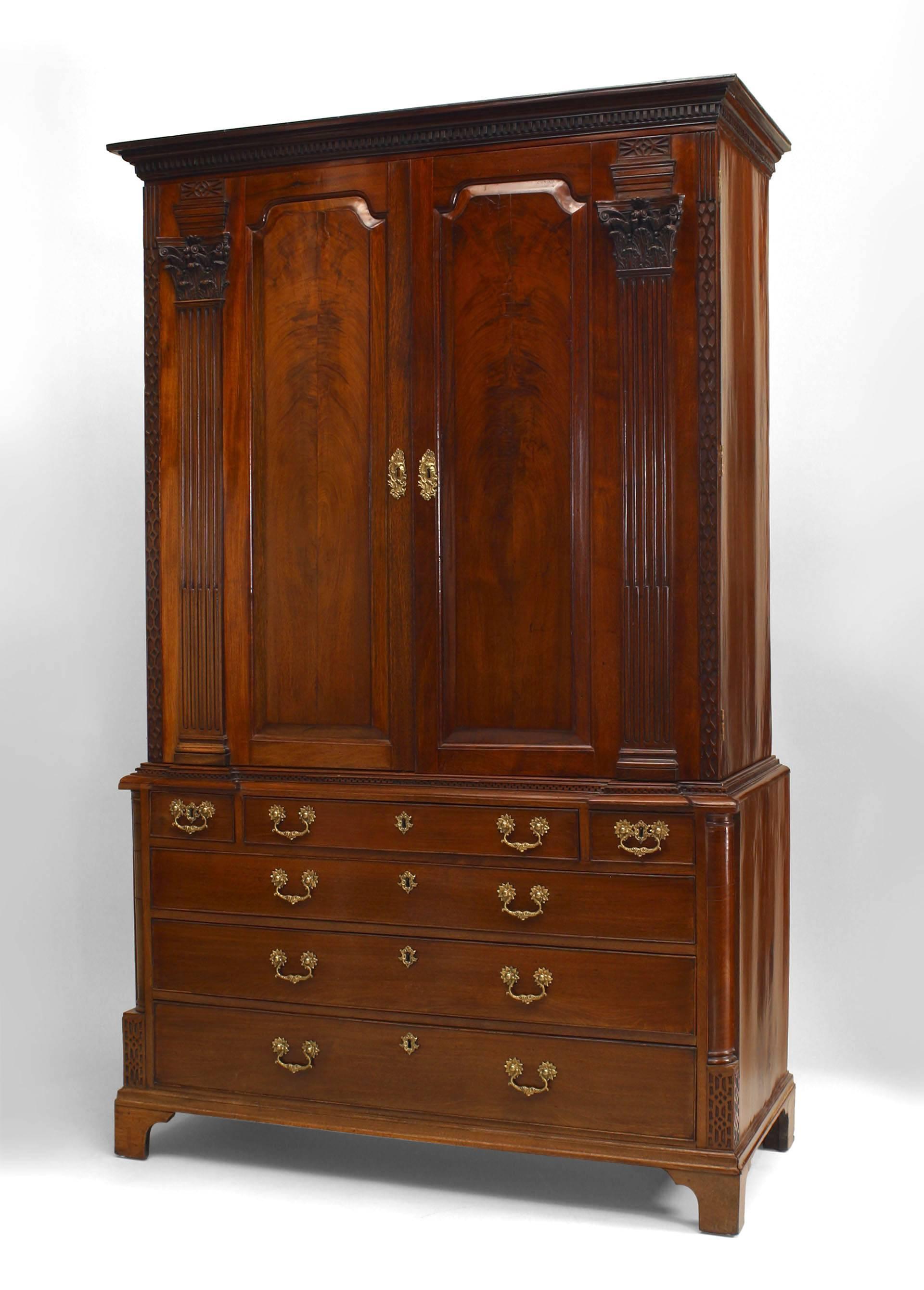 English Georgian (18th Century) mahogany cabinet with a lower section having 4 drawers and a 2 door upper section with carved pilaster columns and lattice sides.
