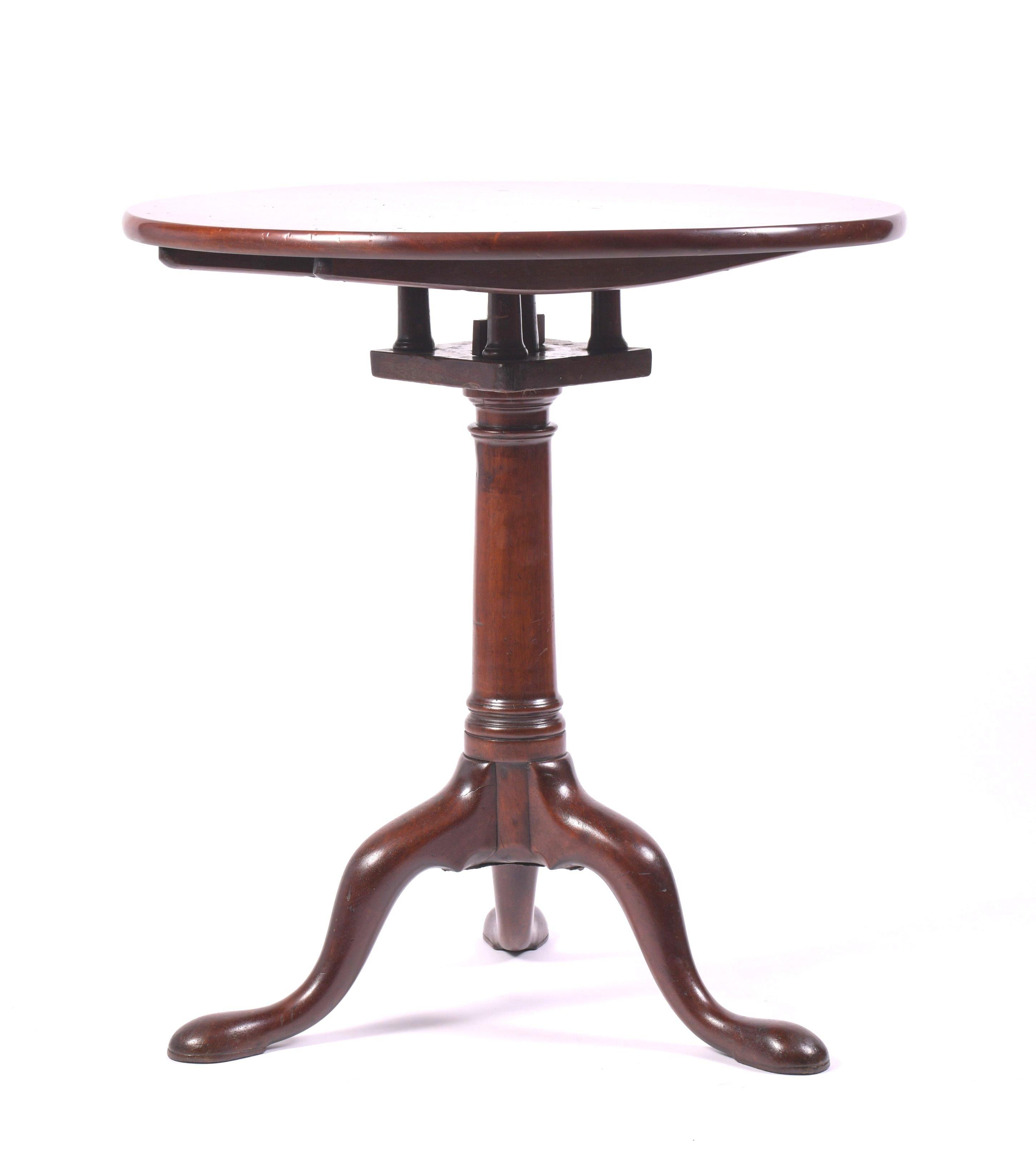 This simple yet Classic style 18th century mahogany tilt-top table features a ‘birdcage‘ design underneath the tabletop and is supported on a central column with a tripod base. It measures 27 ½ in – 70 cm high with the table open and 41 ¾ in – 106