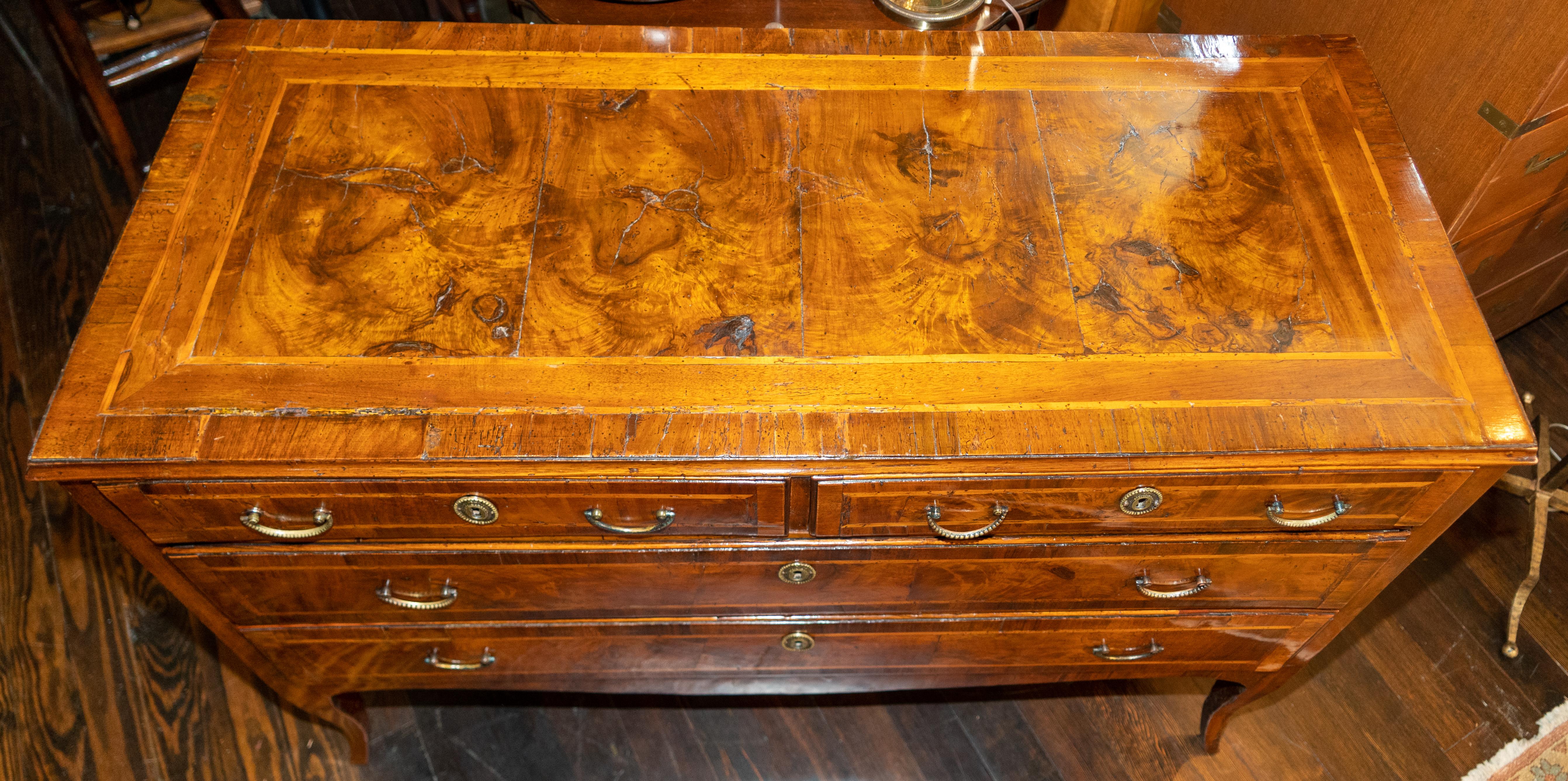 18th century North Italian walnut neoclassic commode circa 1790
Matched burl walnut veneers on the top and drawers. Crossbanded and bold inlays framing all surfaces. Good deep color and highly figured burl walnut veneers. Shallow depth and low