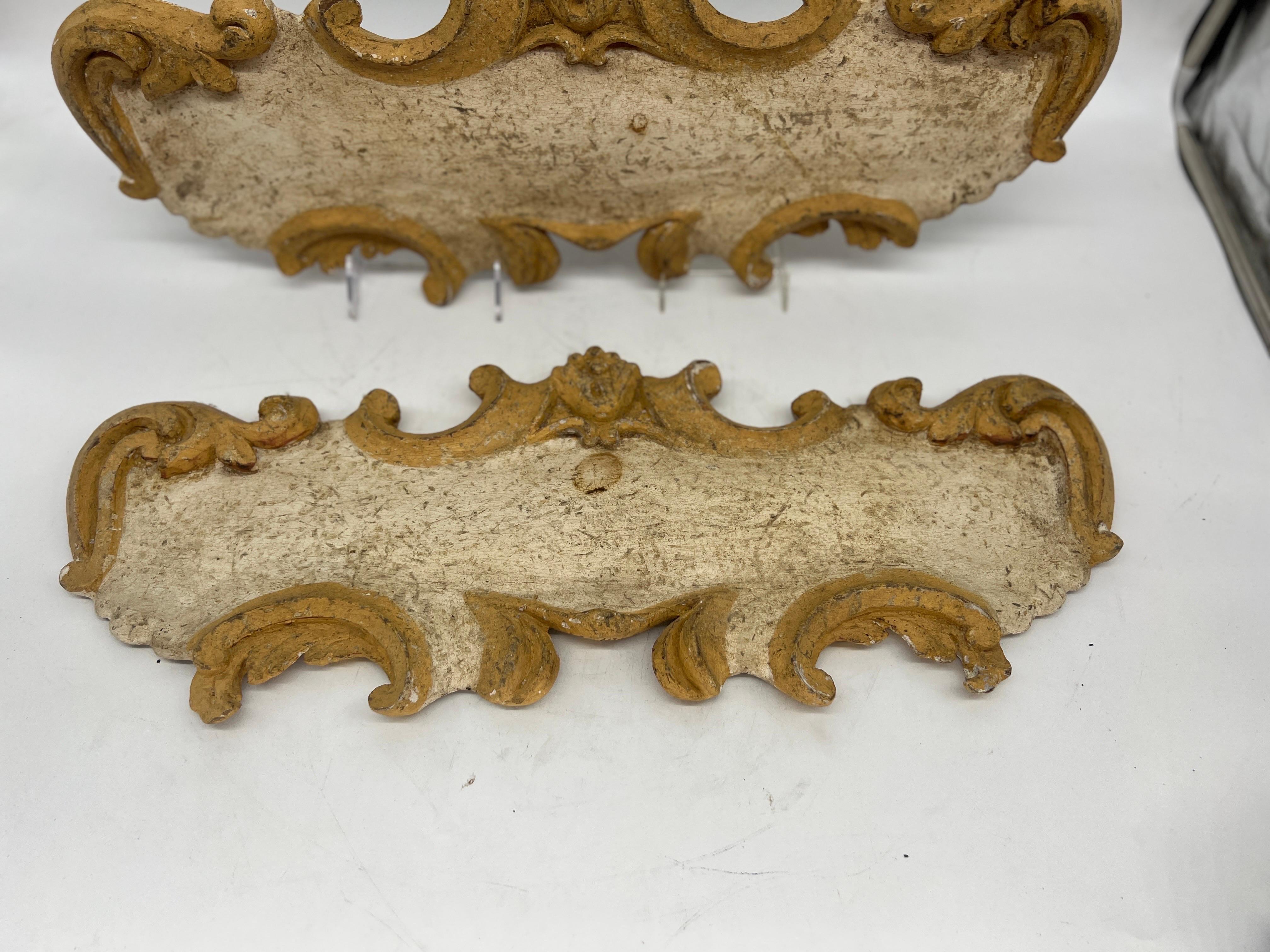 Elevate your interior décor to a level of unparalleled opulence with this magnificent pair of 18th-century French Baroque carved and gilt architectural elements, thoughtfully repurposed as exquisite wall hangings. These remarkable pieces, steeped in