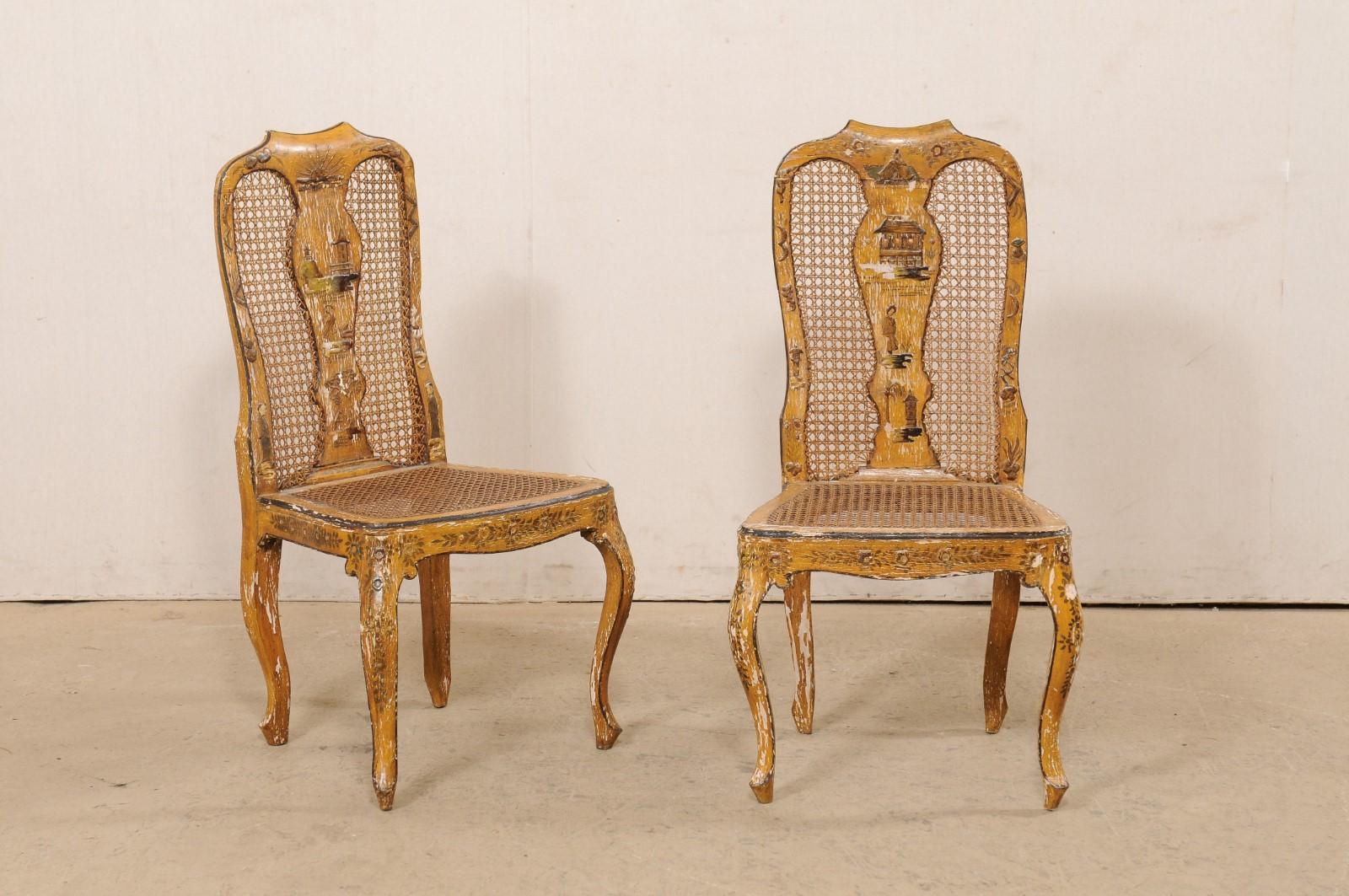 An Italian pair of wooden side chairs with chinoiserie and caning from the 18th century. This antique pair of chairs from Italy each features a shapely wood back with scooped top rail, a carved back-splat, with hand-caning framed within the splat