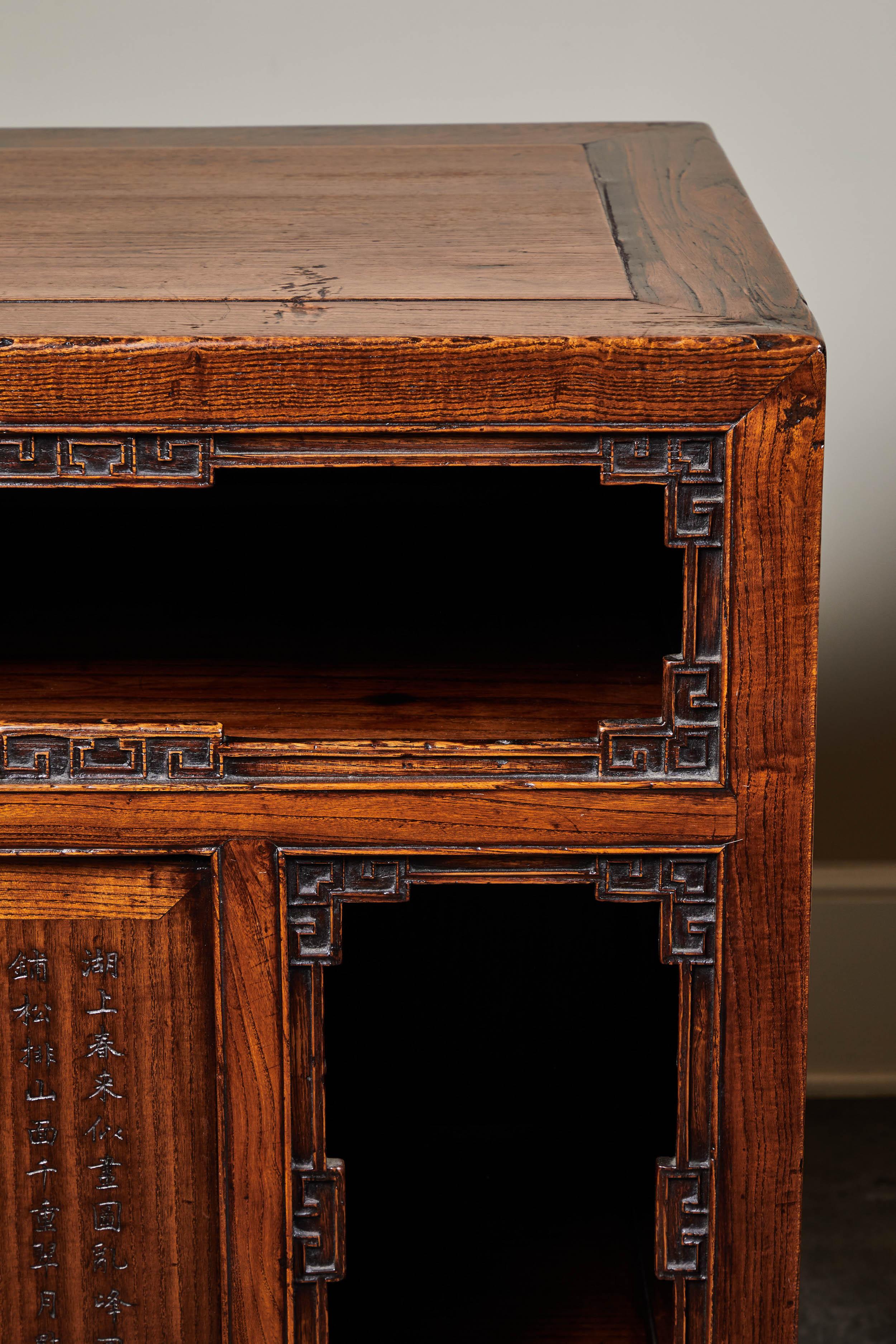 One of a kind elm side cabinets with “key design carving” and calligraphy from Shanshi, circa 18th century.