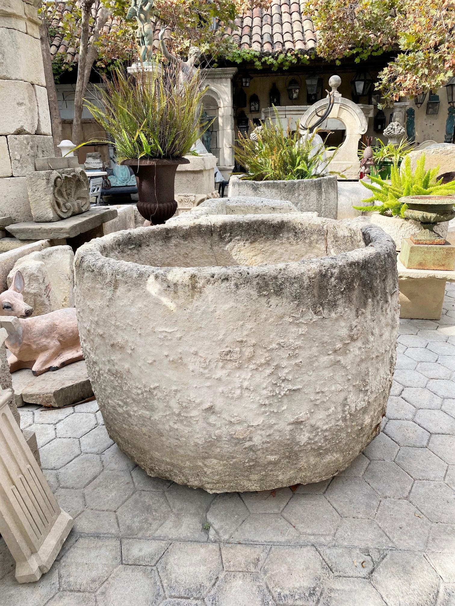 Exquisite 18th century round hand carved stone water fountain basin. This water trough could be installed with a simple bronze spout or a carved stone fountainhead, we have many options of them, in order to create a charming garden water fountain