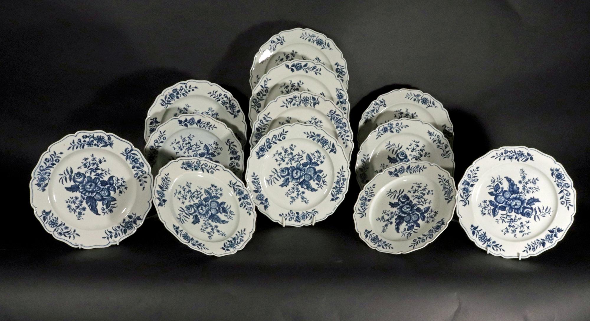 First Period Worcester Underglaze Blue Porcelain Pine Cone Pattern Dinner Plates,
A Set of Twelve,
Circa 1770.

From a collection of Pine Cone pieces including a soup tureen and stand, dishes in sizes, basin and Junket dish.

The set of large dinner