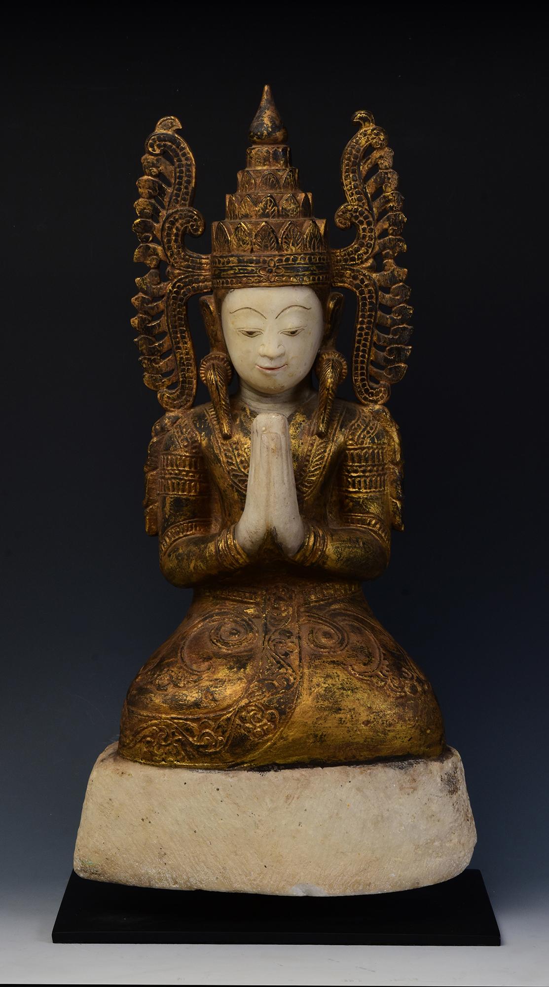 Antique Burmese alabaster seated crowned Buddha, or sometimes known as 'King Buddha', wearing diadem-crowns and ornaments of kings instead of ordinary monk's robes.

Crowned Buddha represents the Buddha's role as a universal sovereign.

Age: Burma,
