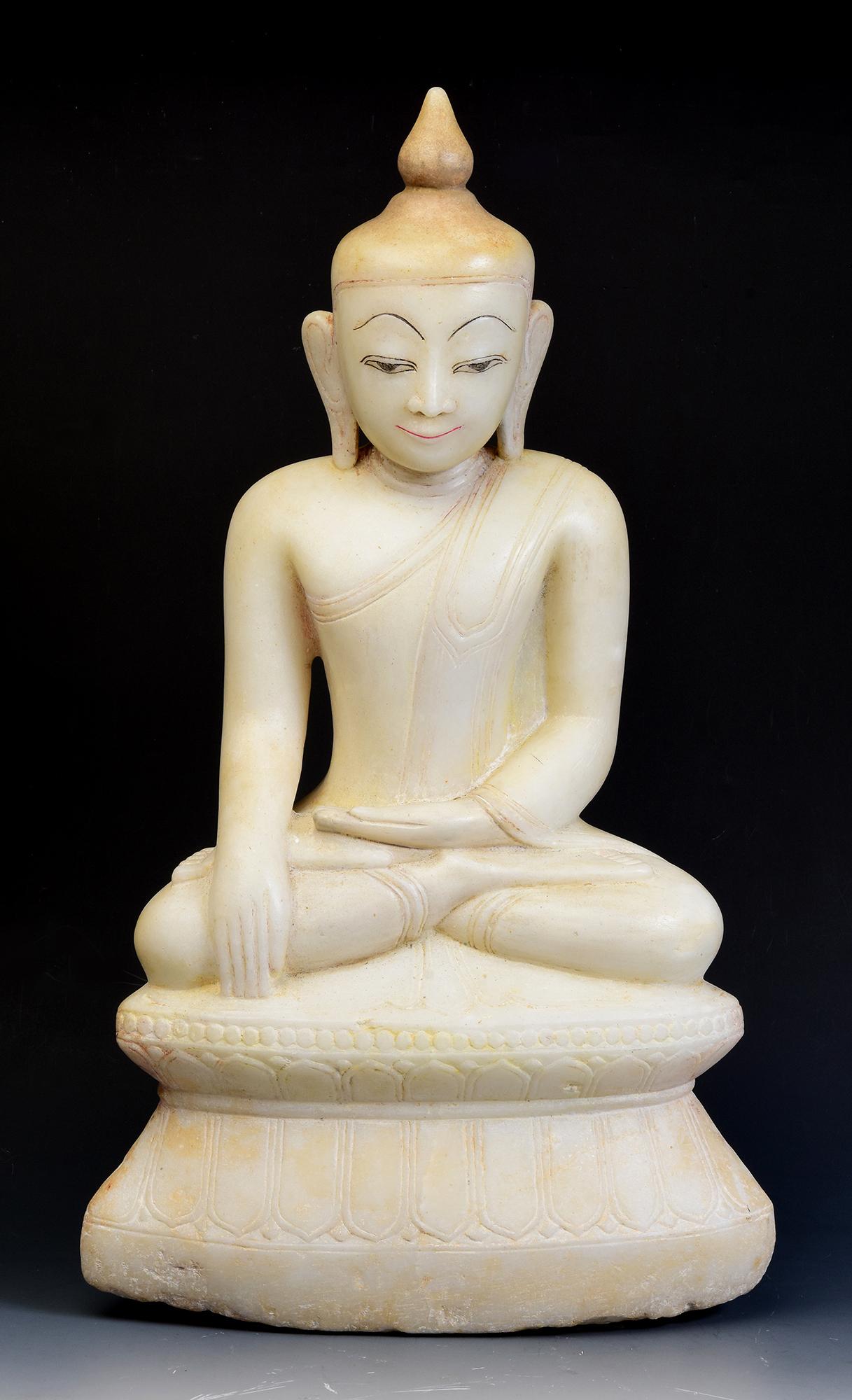Antique Burmese alabaster Buddha sitting in Mara Vijaya (calling the earth to witness) posture on double lotus base.

Age: Burma, Shan Period, 18th Century
Size: Height 54.8 C.M. / Width 31.4 C.M. / Depth 16.5 C.M.
Condition: Nice condition overall