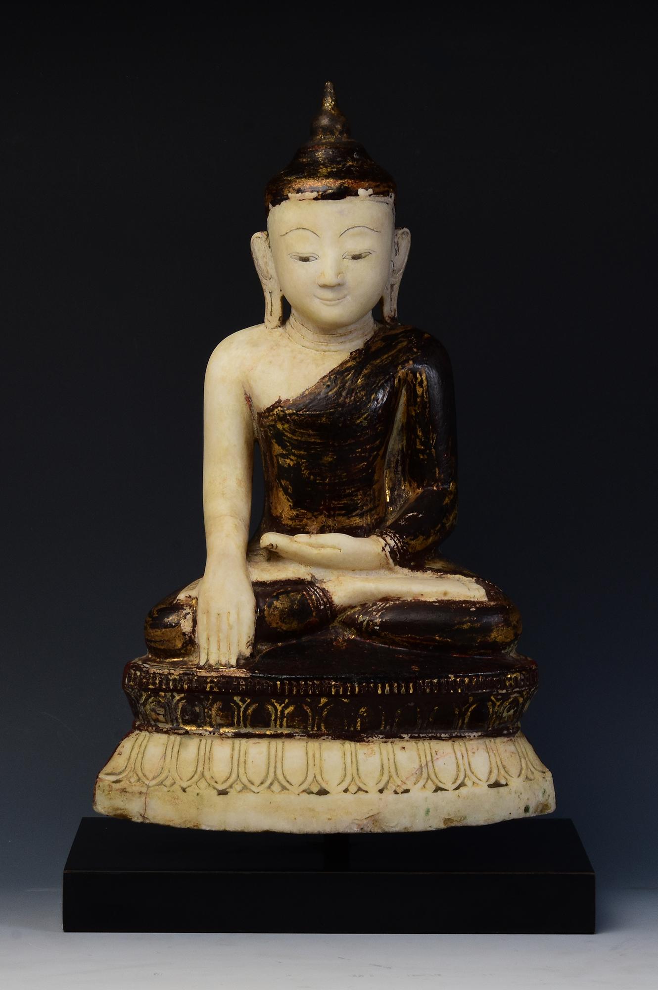 Antique Burmese alabaster Buddha sitting in Mara Vijaya (calling the earth to witness) posture on double lotus base with original black lacquer.

Age: Burma, Shan Period, 18th Century
Size excluding black stand: Height 45.5 C.M. / Width 27.7 C.M. /