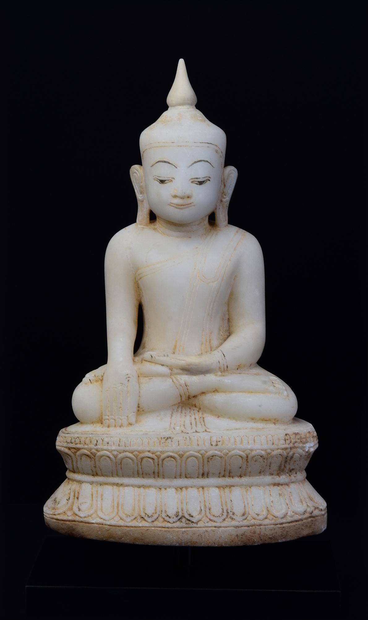 Antique Burmese alabaster Buddha sitting in Mara Vijaya (calling the earth to witness) posture on double lotus base.

Age: Burma, Shan Period, 18th Century
Size excluding black stand: Height 36 C.M. / Width 21.5 C.M. / Depth 13.2 C.M.
Height