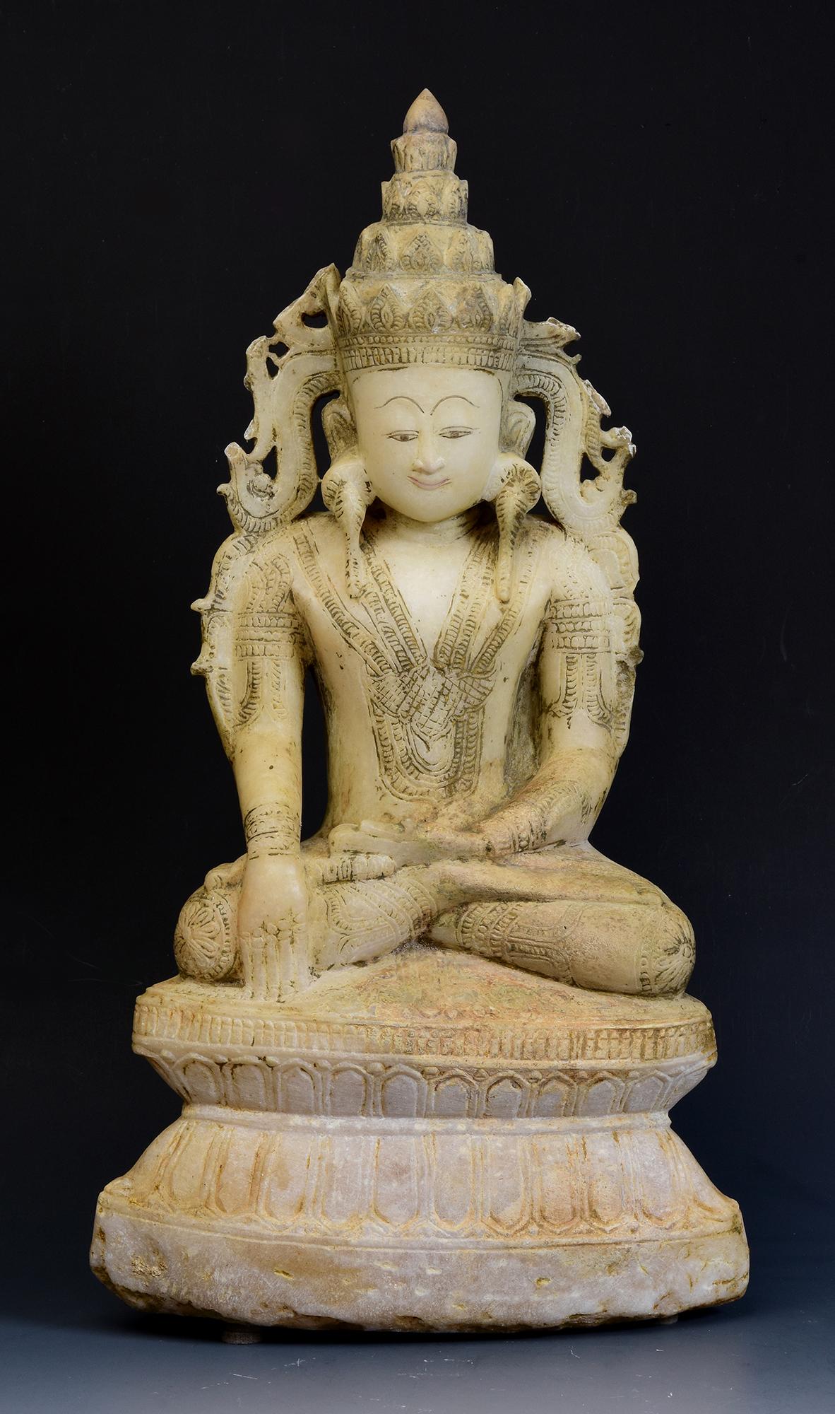Rare antique Burmese alabaster seated crowned Buddha or sometimes known as 'King Buddha', wearing diadem-crowns and ornaments of king instead of ordinary monk's robes.

Age: Burma, Shan Period, 18th Century
Size: Height 46.5 C.M. / Width 25.1 C.M. /