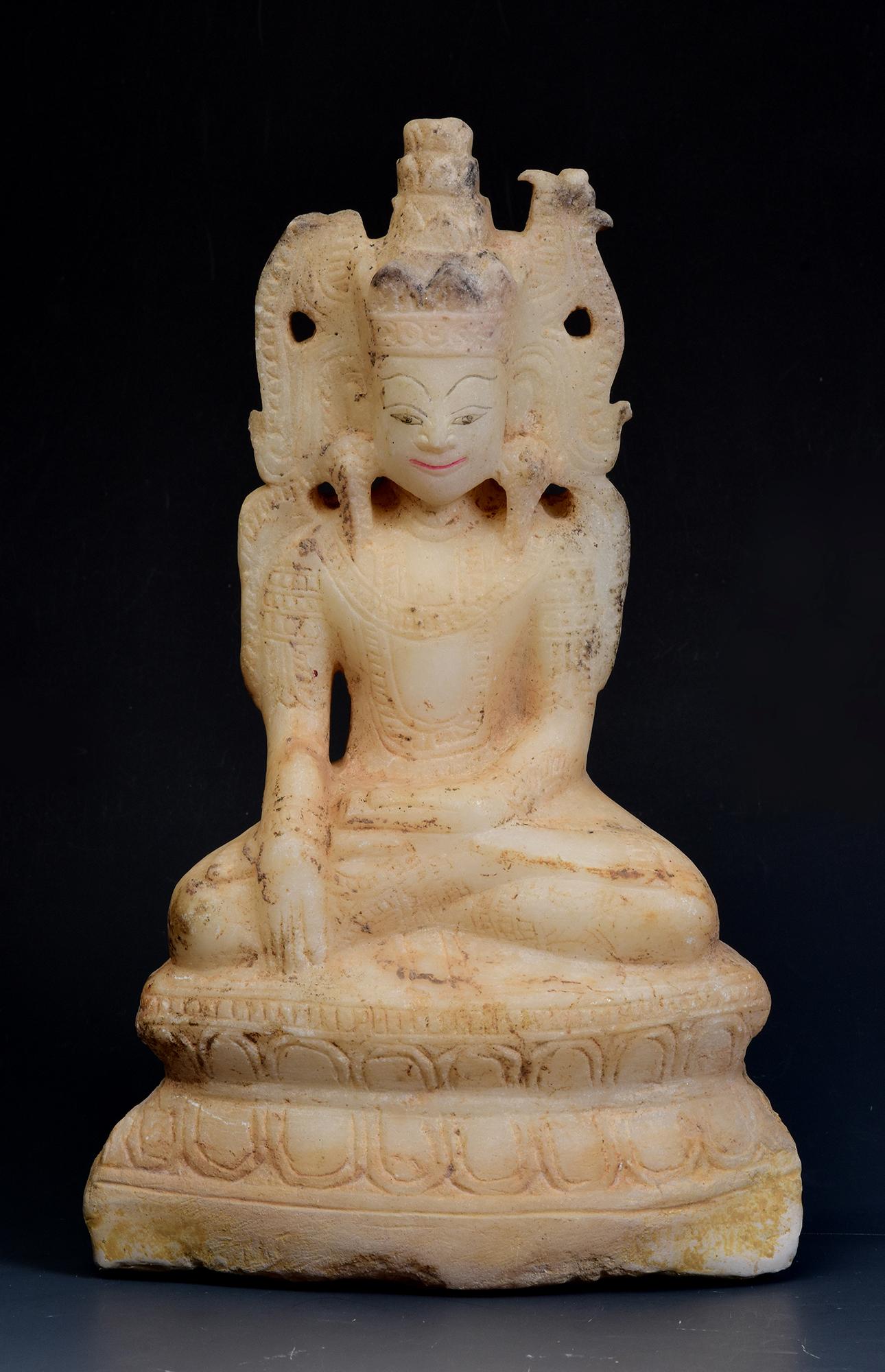 Rare antique Burmese alabaster seated crowned Buddha or sometimes known as 'King Buddha', wearing diadem-crowns and ornaments of king instead of ordinary monk's robes.

Age: Burma, Shan Period, 18th Century
Size: Height 24.8 C.M. / Width 15.5 C.M. /