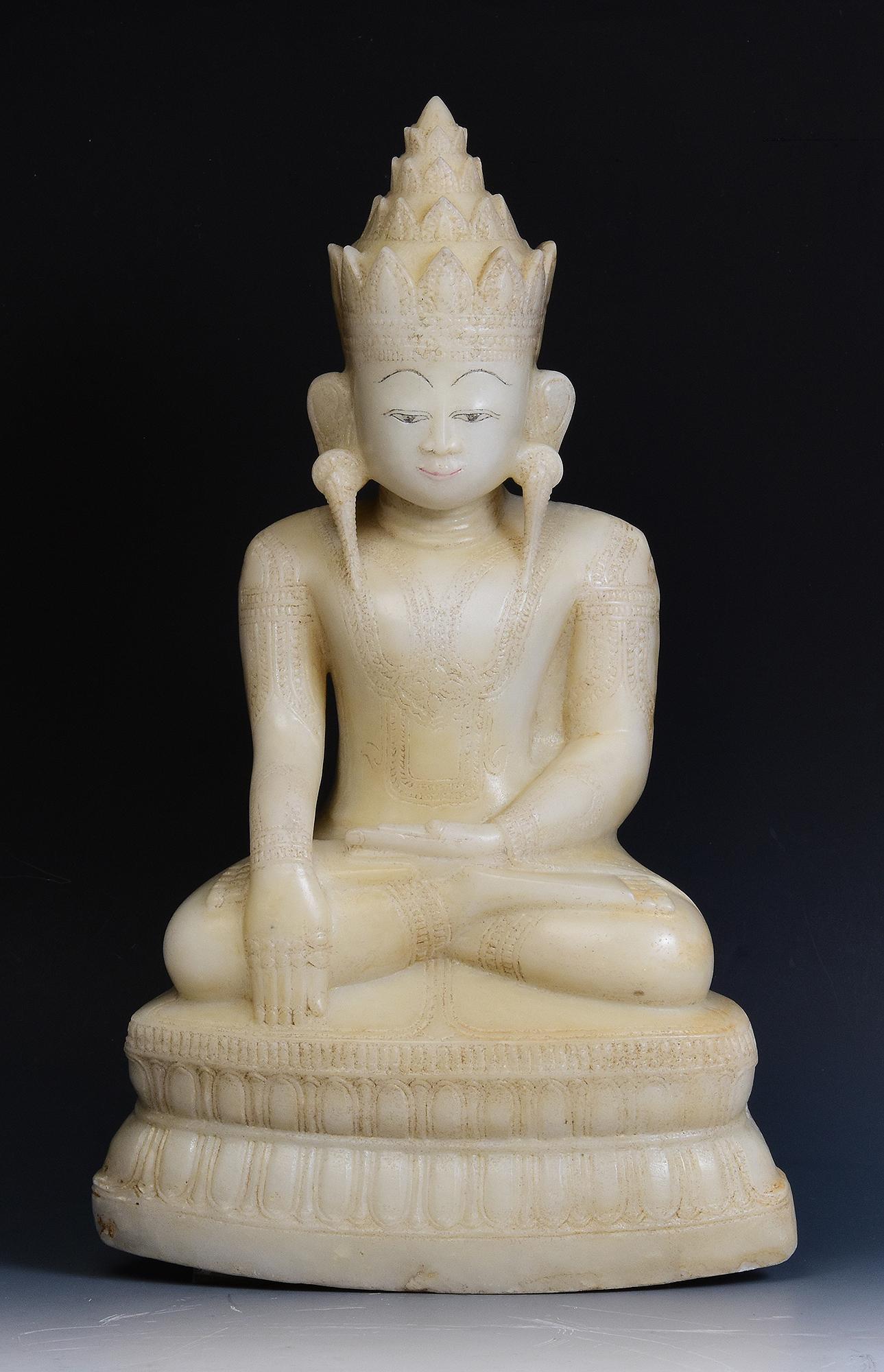Rare antique Burmese alabaster seated crowned Buddha, or sometimes known as 'King Buddha', wearing diadem-crowns and ornaments of kings instead of ordinary monk's robes.

Crowned Buddha represents the Buddha's role as a universal sovereign.

Age: