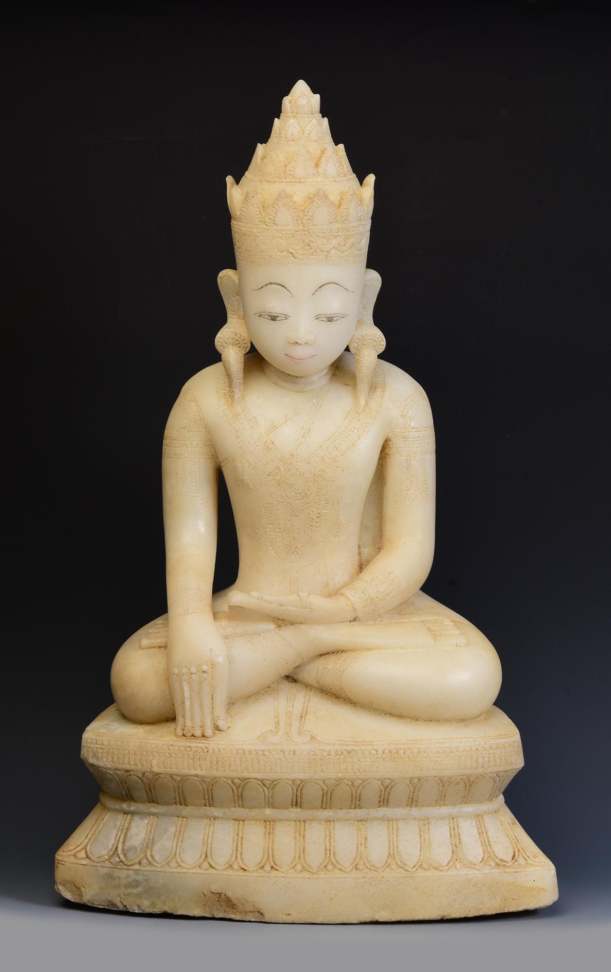 Rare antique Burmese alabaster seated crowned Buddha or sometimes known as 'King Buddha', wearing diadem-crowns and ornaments of king instead of ordinary monk's robes.

Age: Burma, Shan Period, 18th Century
Size: Height 54.5 C.M. / Width 32.5 C.M. /