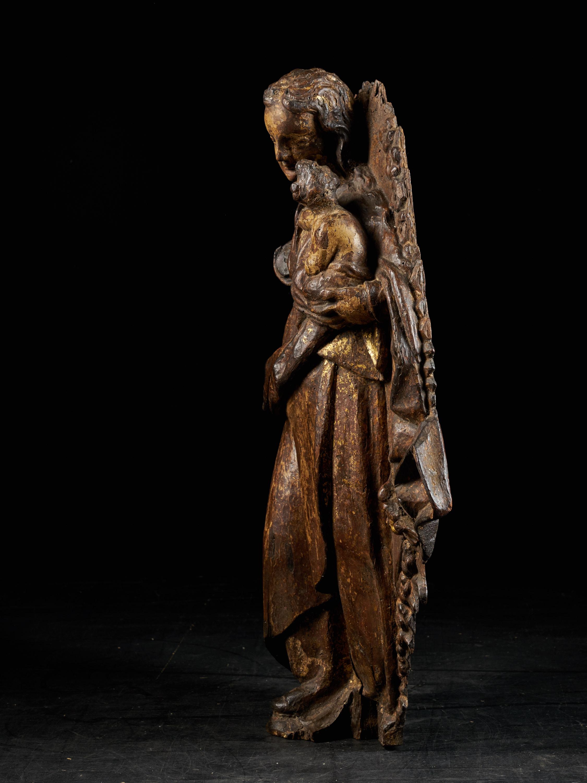 Hand-Carved Spanish Shool, Gilded Wooden Relief Sculpture of a Virgin Carrying a Child