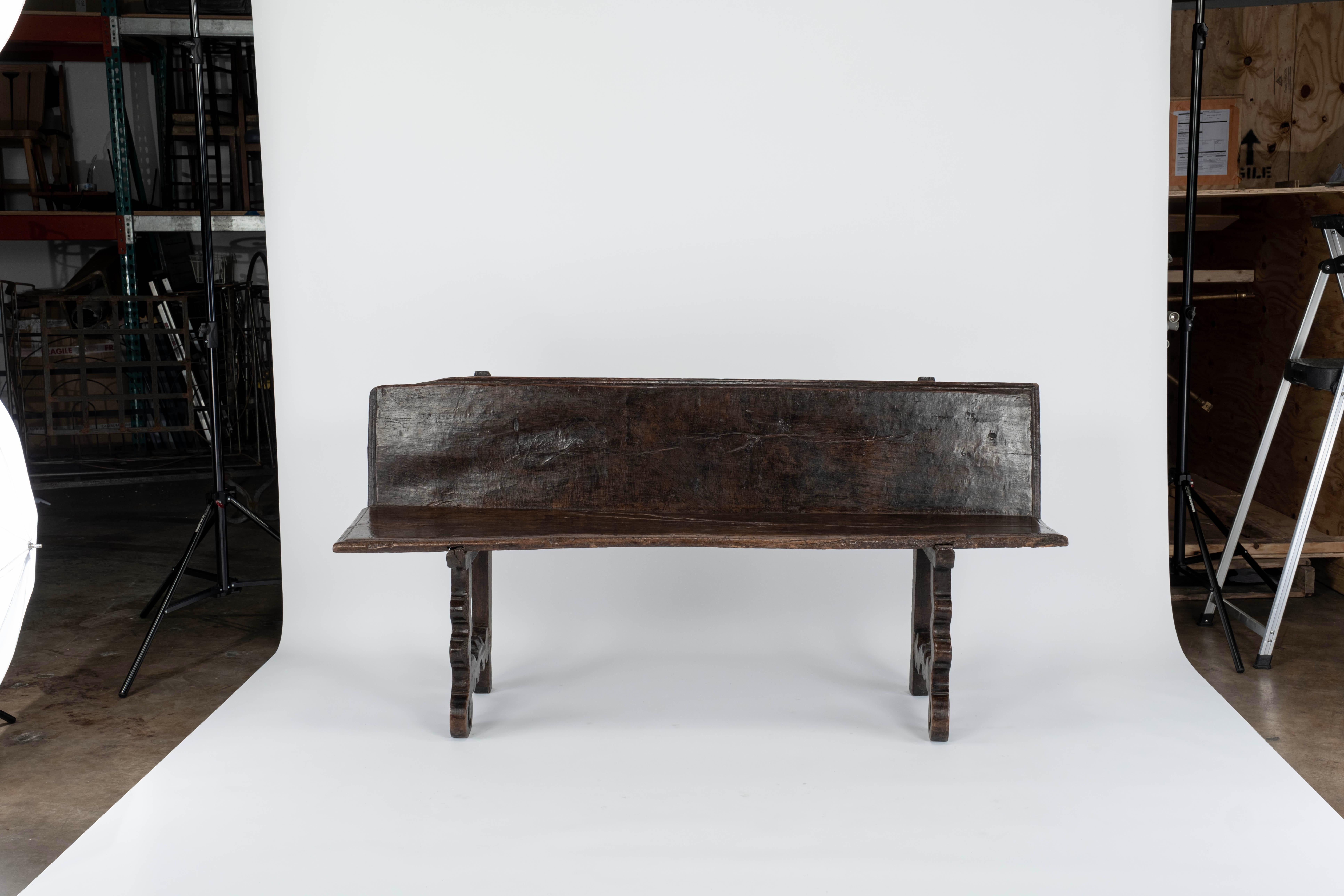 Beautiful Walnut Spanish Bench on carved legs.  Great patina to the wood.