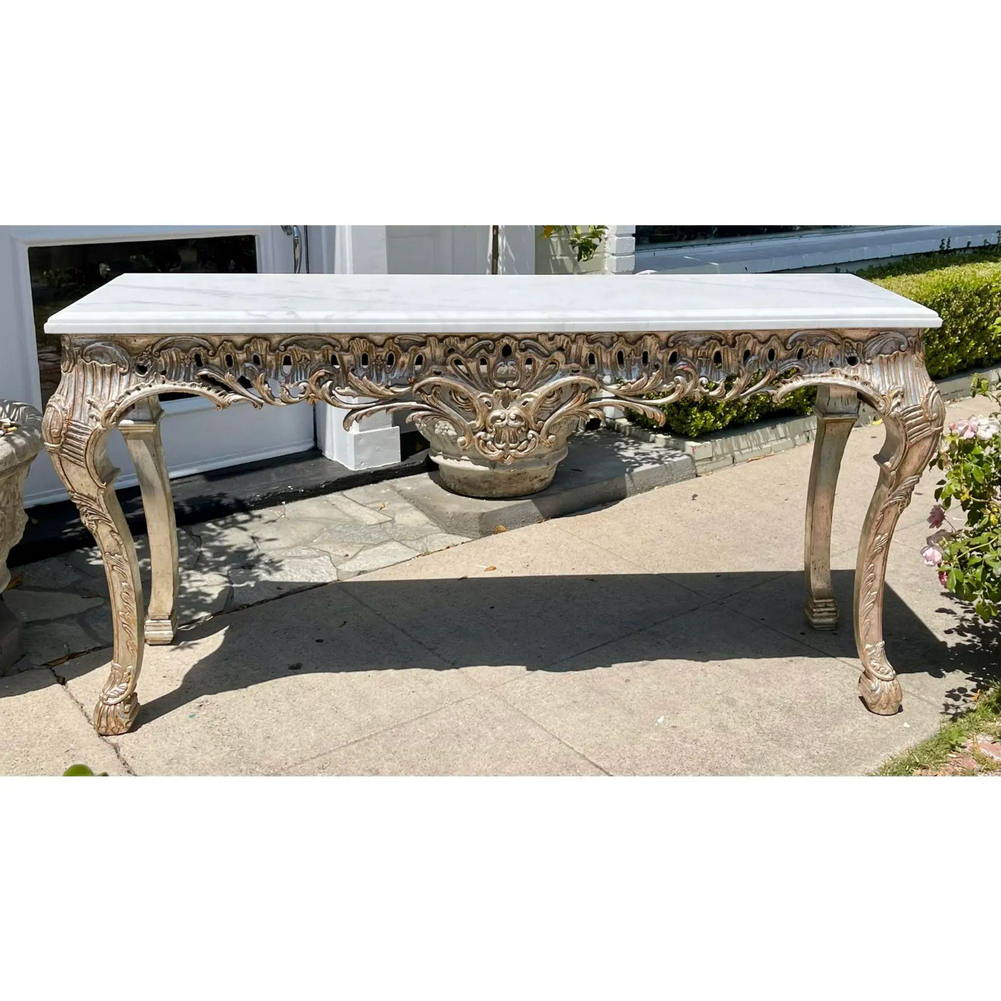 18th C Style Giltwood & Calcutta marble console table

Additional information: 
Materials: Giltwood, Marble
Color: Silver
Period: 2010s
Styles: Louis XVI, Rococo
Table Shape: Rectangle
Item Type: Vintage, Antique or Pre-owned
Dimensions: